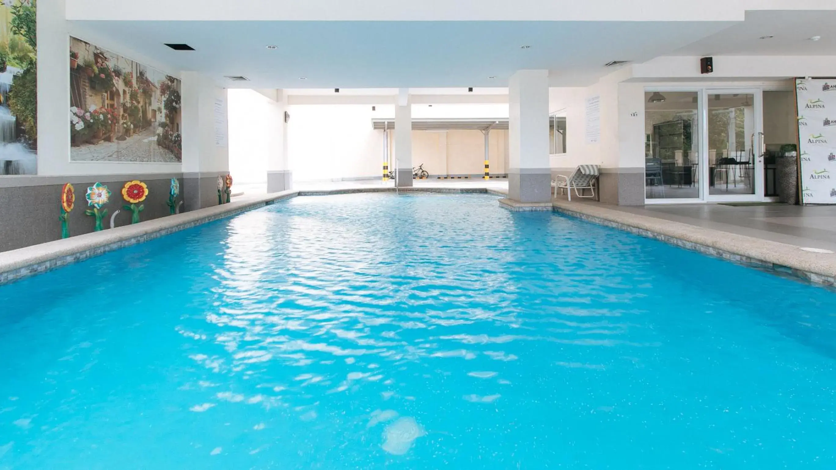 Pool view in RedDoorz Plus at Alpina Heights Paranaque Pool view in RedDoorz Plus at Alpina Heights Paranaque