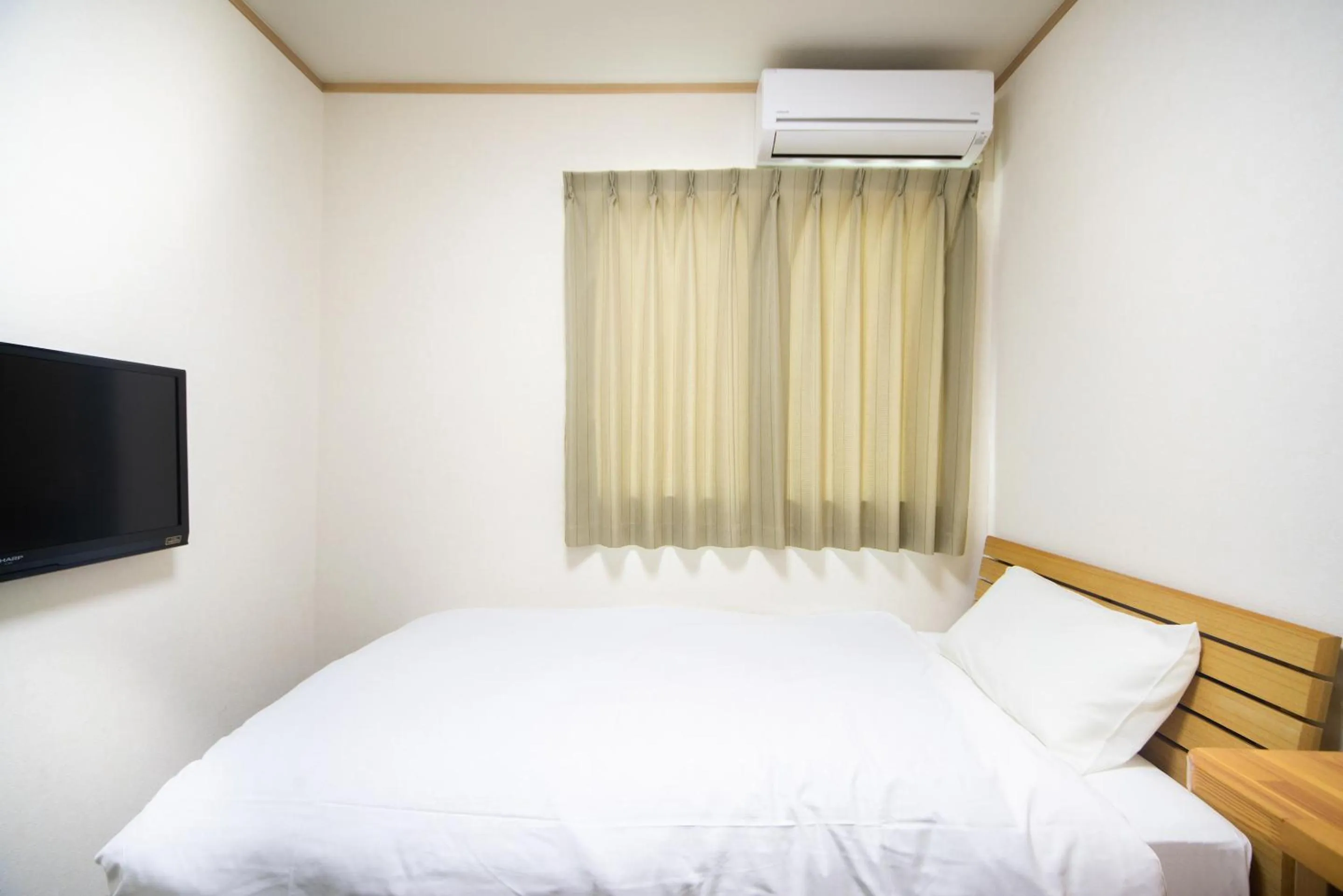 Bed in Tabist Hotel Daimu Minami-Souma