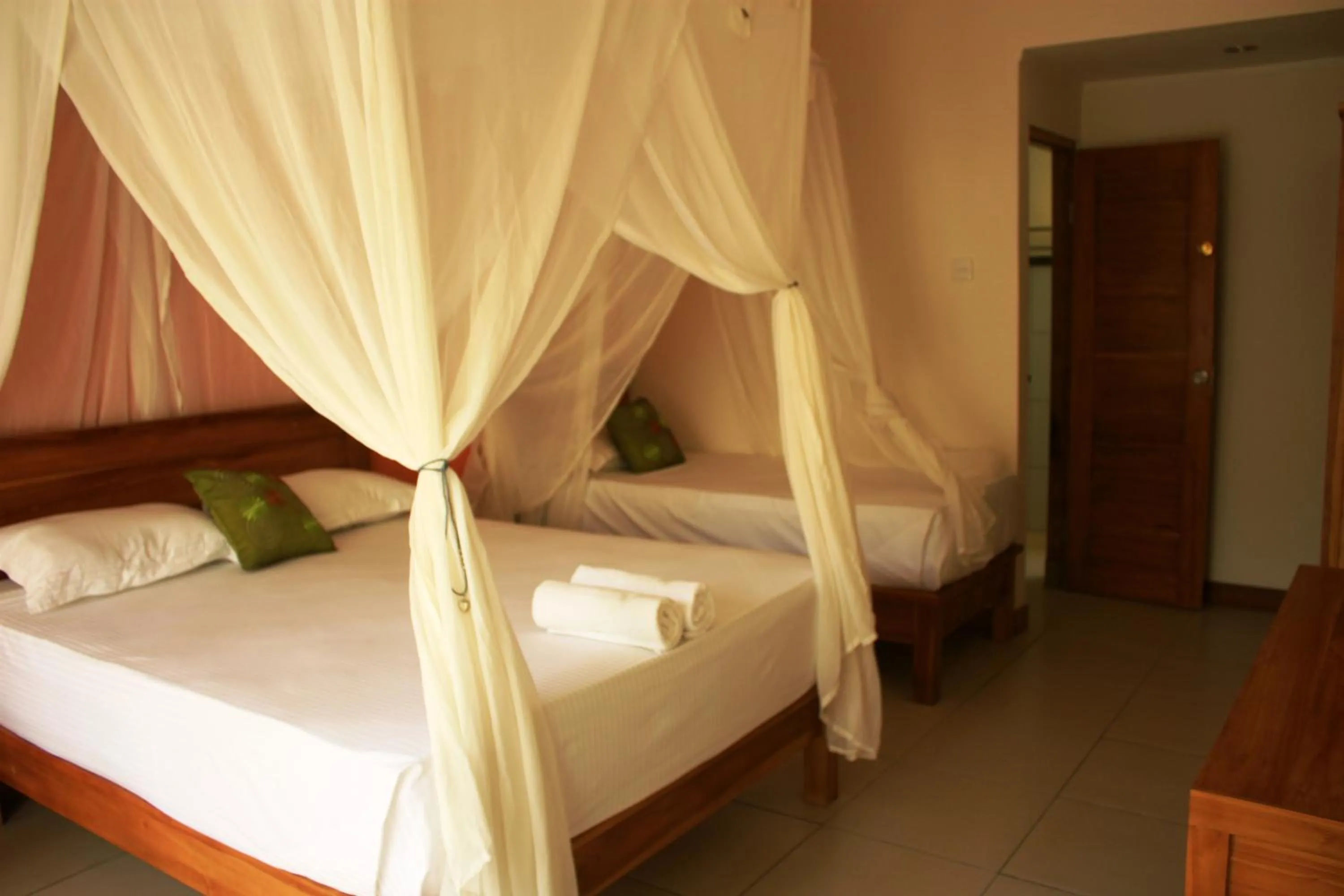 Bed in Arjuna Homestay