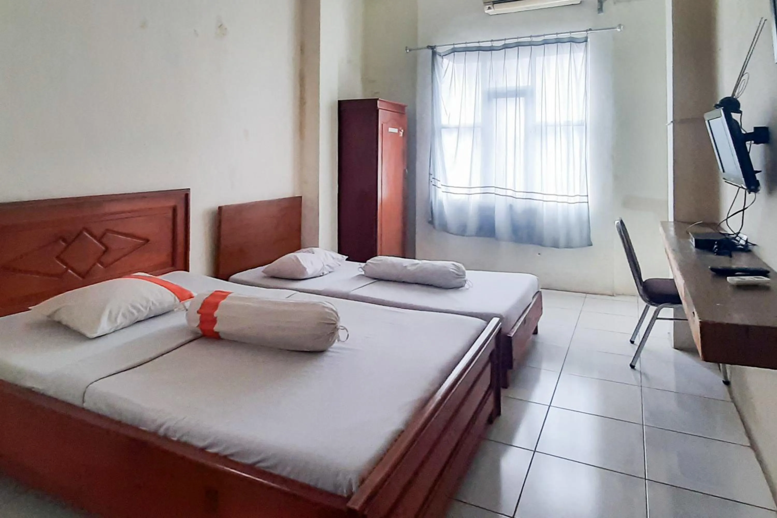 Bed in RedDoorz Syariah At Penginapan Sederhana Palembang