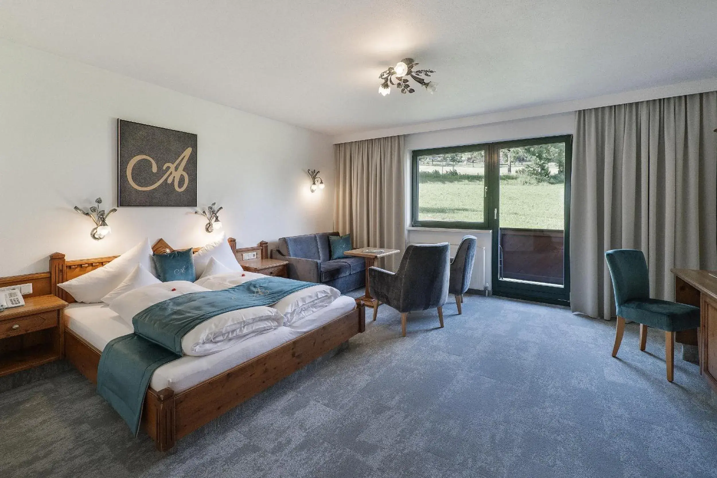 Photo of the whole room, Bed in Hotel AlpenSchlössl Photo of the whole room, Bed in Hotel AlpenSchlössl