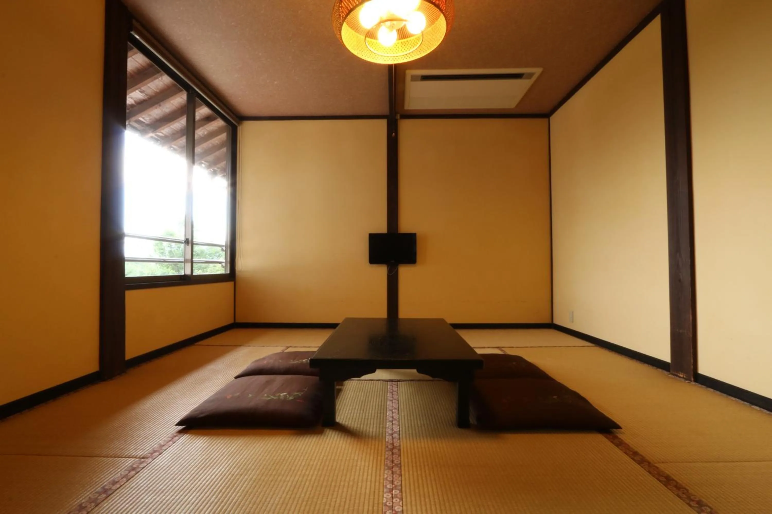 Bed in Tabinoyado Asonoyu