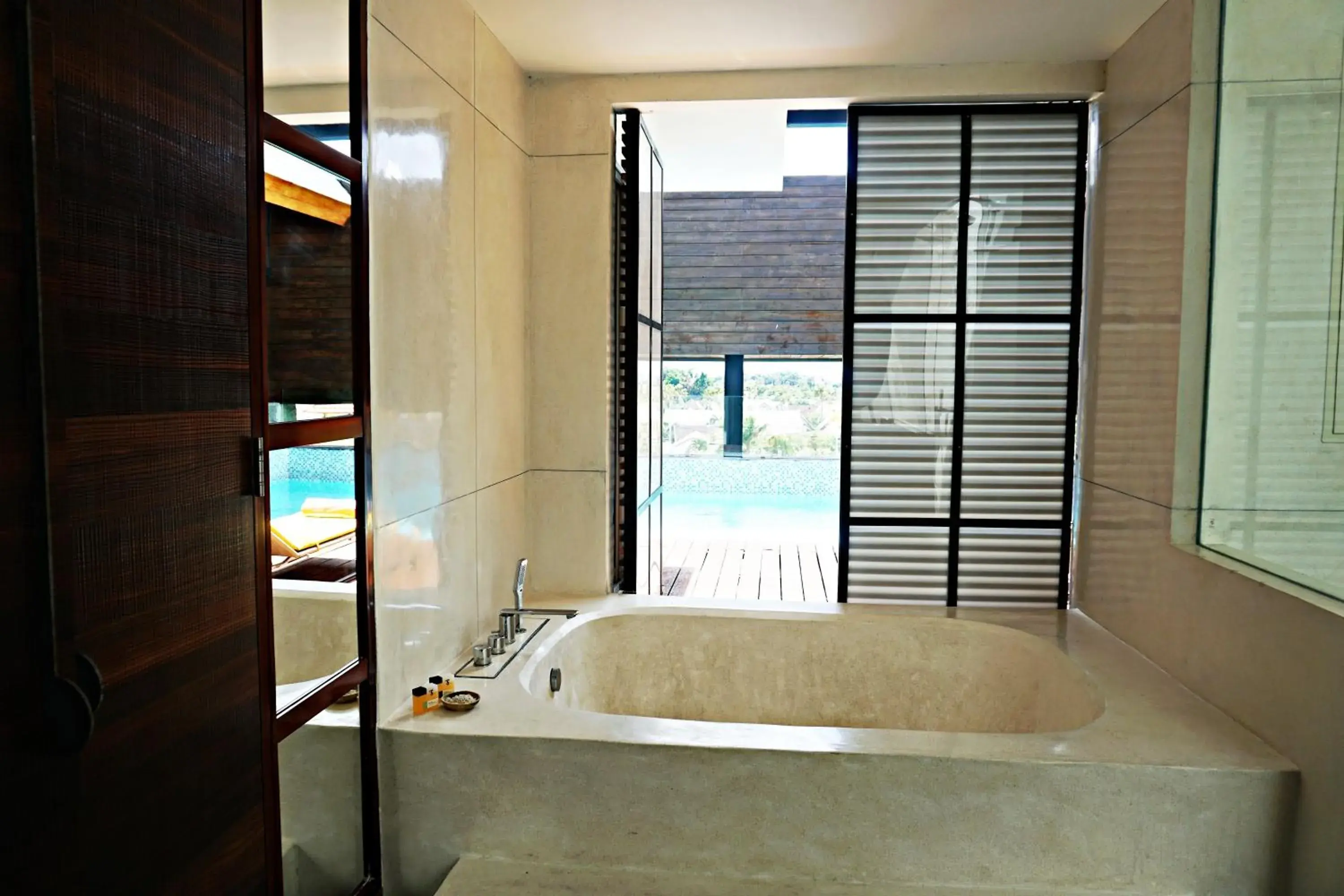 Bath, Bed in TS SUITES Seminyak Bali Bath, Bed in TS SUITES Seminyak Bali