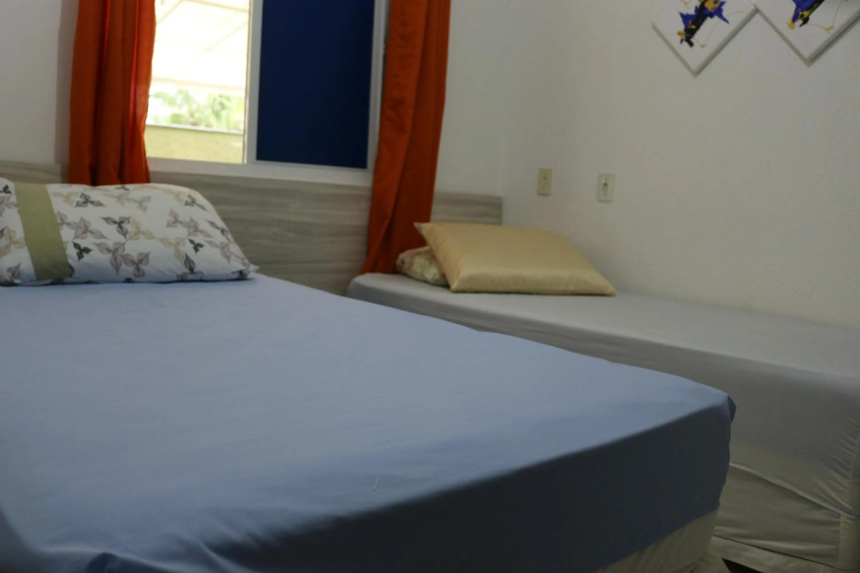 Bed in Pousada Executiva SolRiso Aeroporto Florianópolis