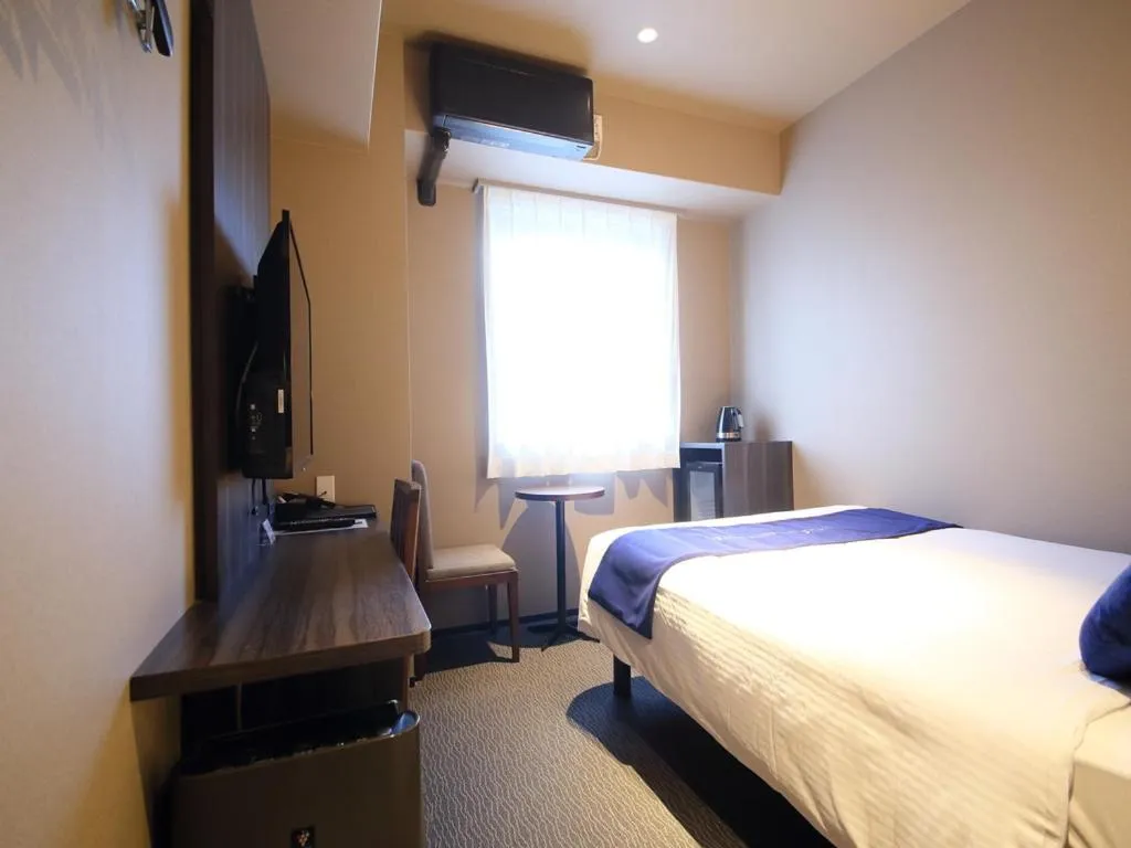 Bed in Dynasty Hotel & Resort Osaka