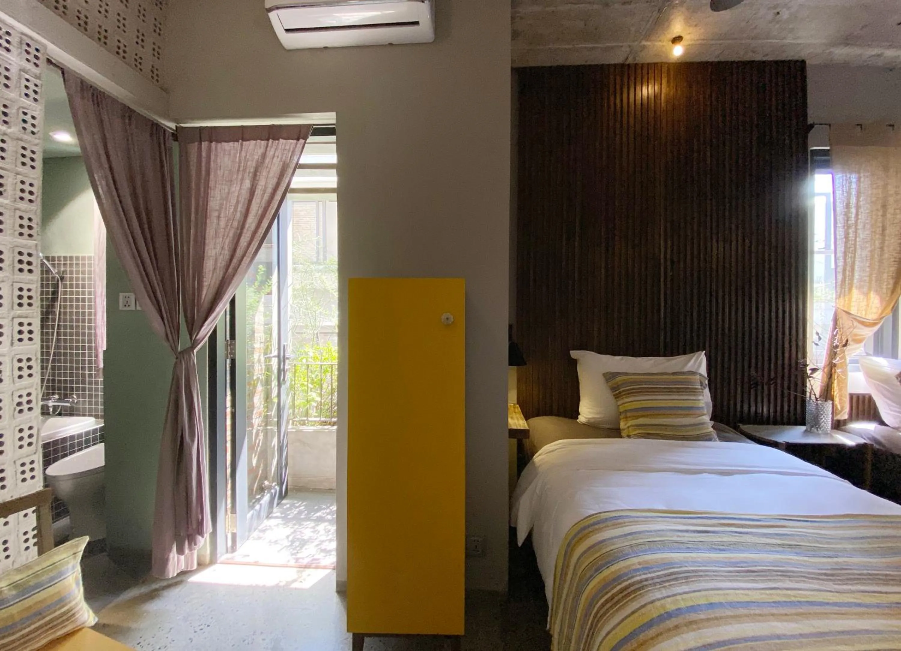 Bed in Kaia Gallery Hotel Hoi An