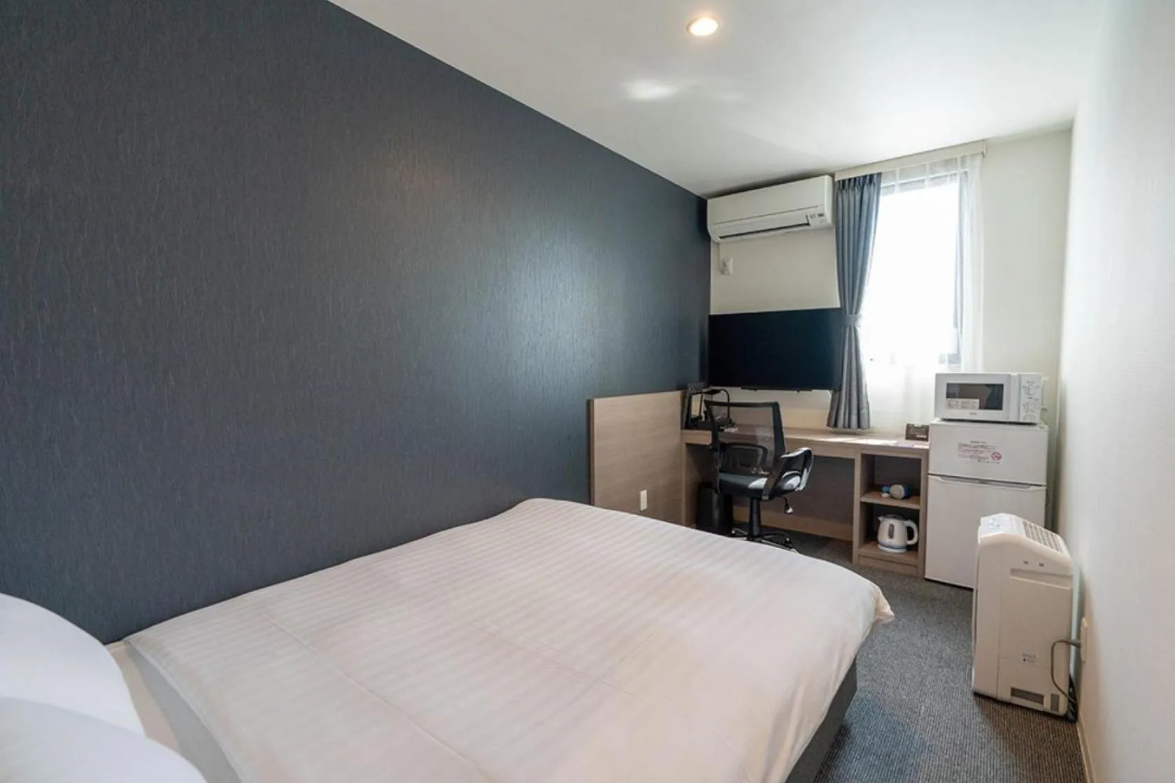 Photo of the whole room, Bed in HOTEL R9 The Yard Yuki