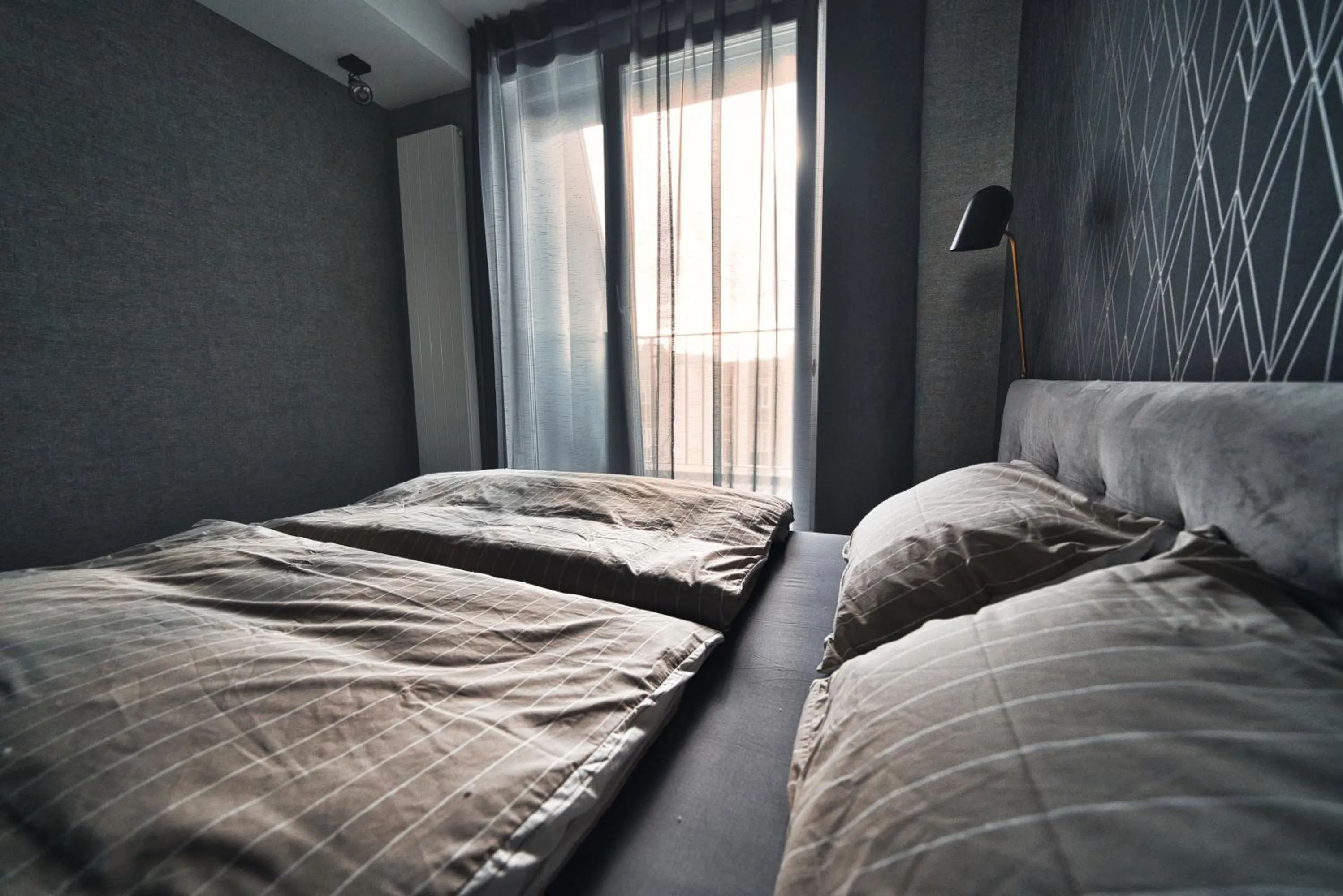 Scan QR code for apartment video tour - free parking, gym access, air conditioning, kitchen and more in central Riga