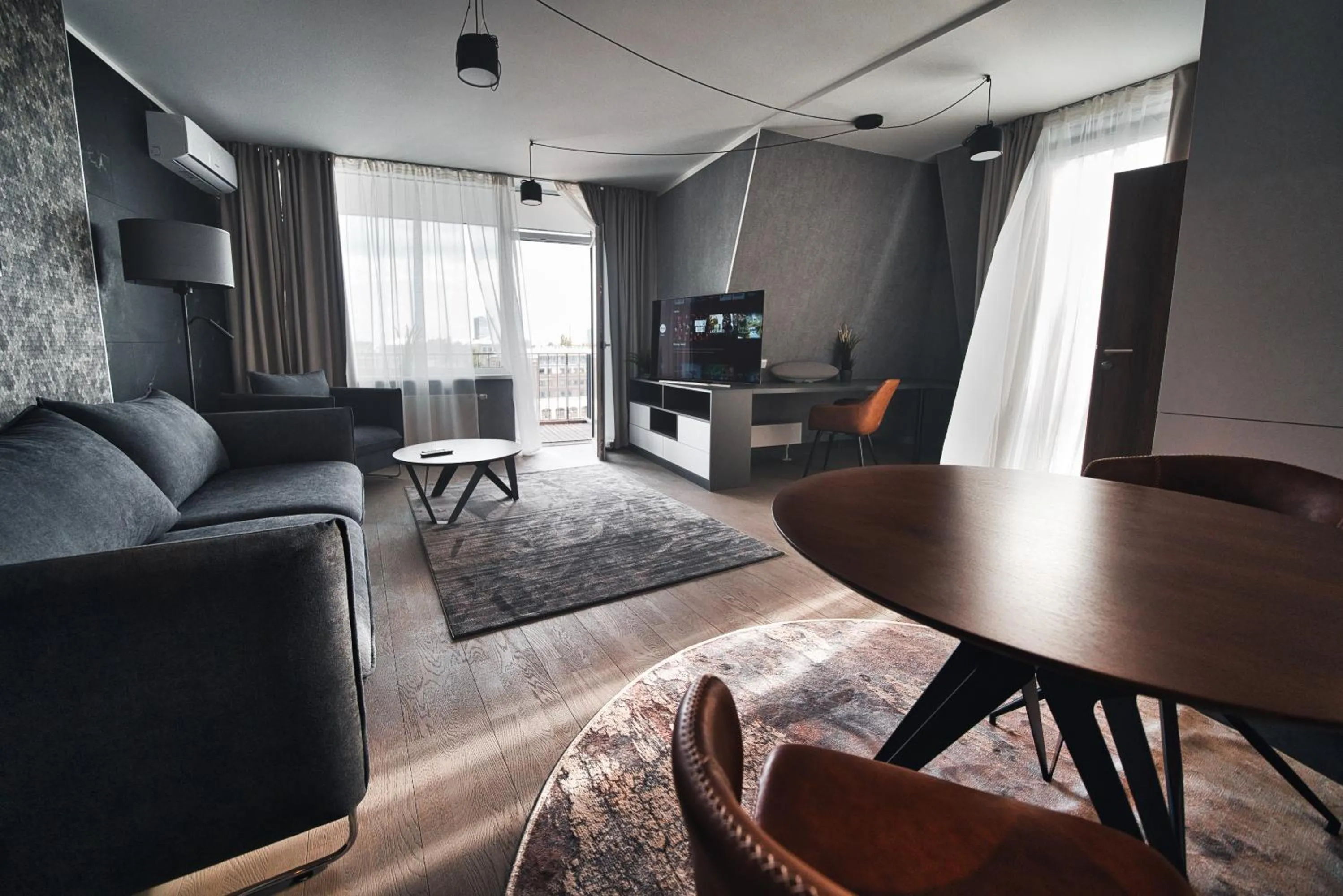 Scan QR code for apartment video tour - free parking, gym access, air conditioning, kitchen and more in central Riga