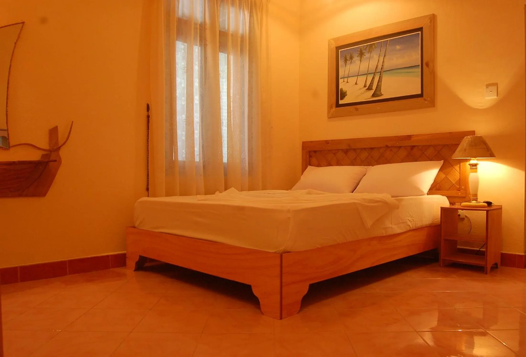 Bed in Vaali Maldives Island Escapes & Dive