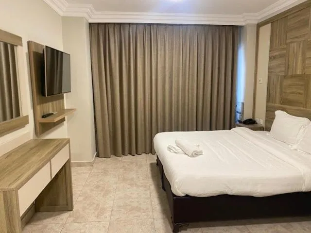 Bed in Mass Paradise Hotel