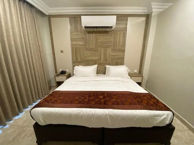 Bed in Mass Paradise Hotel