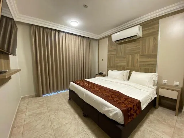 Bed in Mass Paradise Hotel