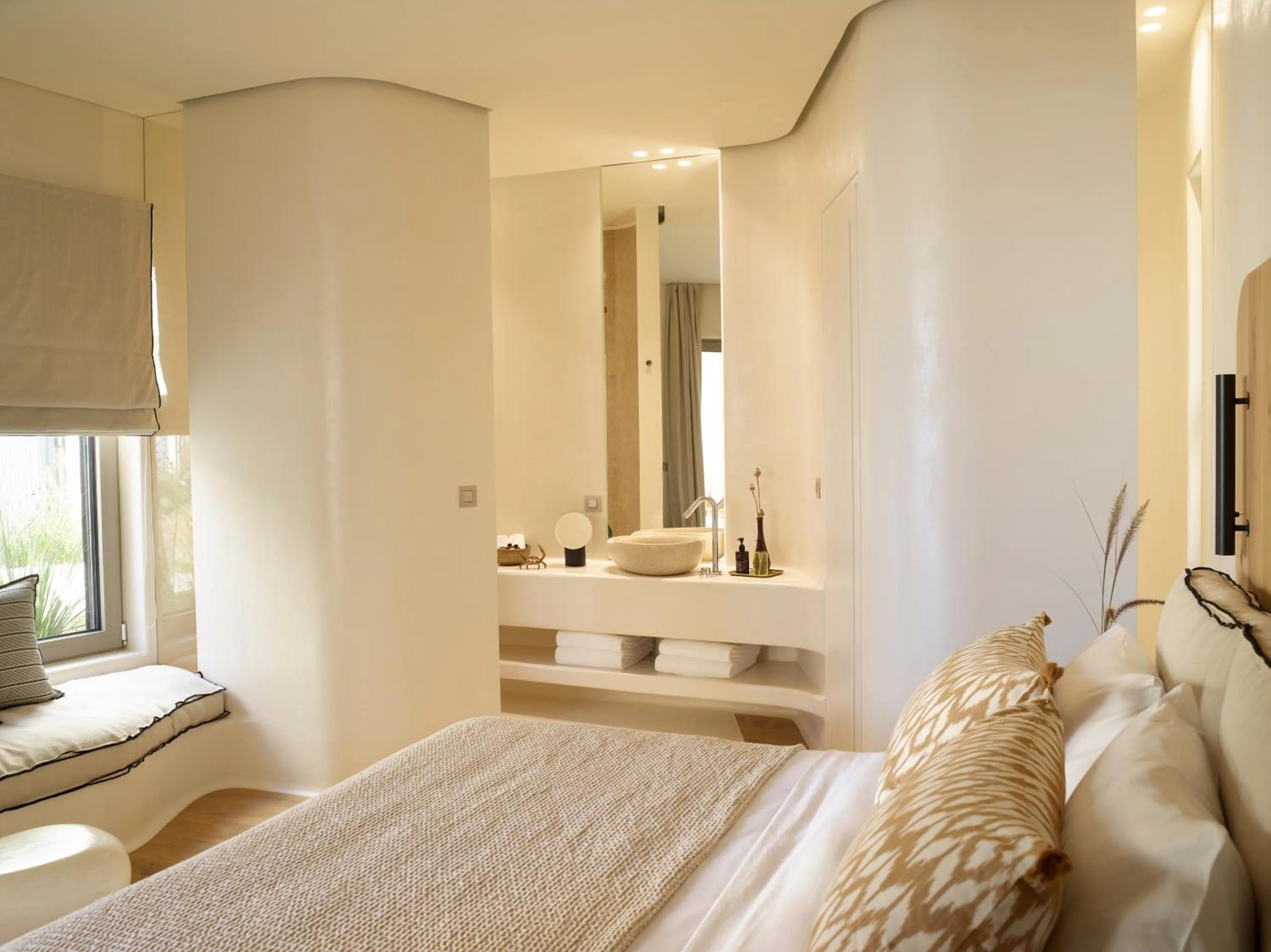 Bed in White Pebble Suites