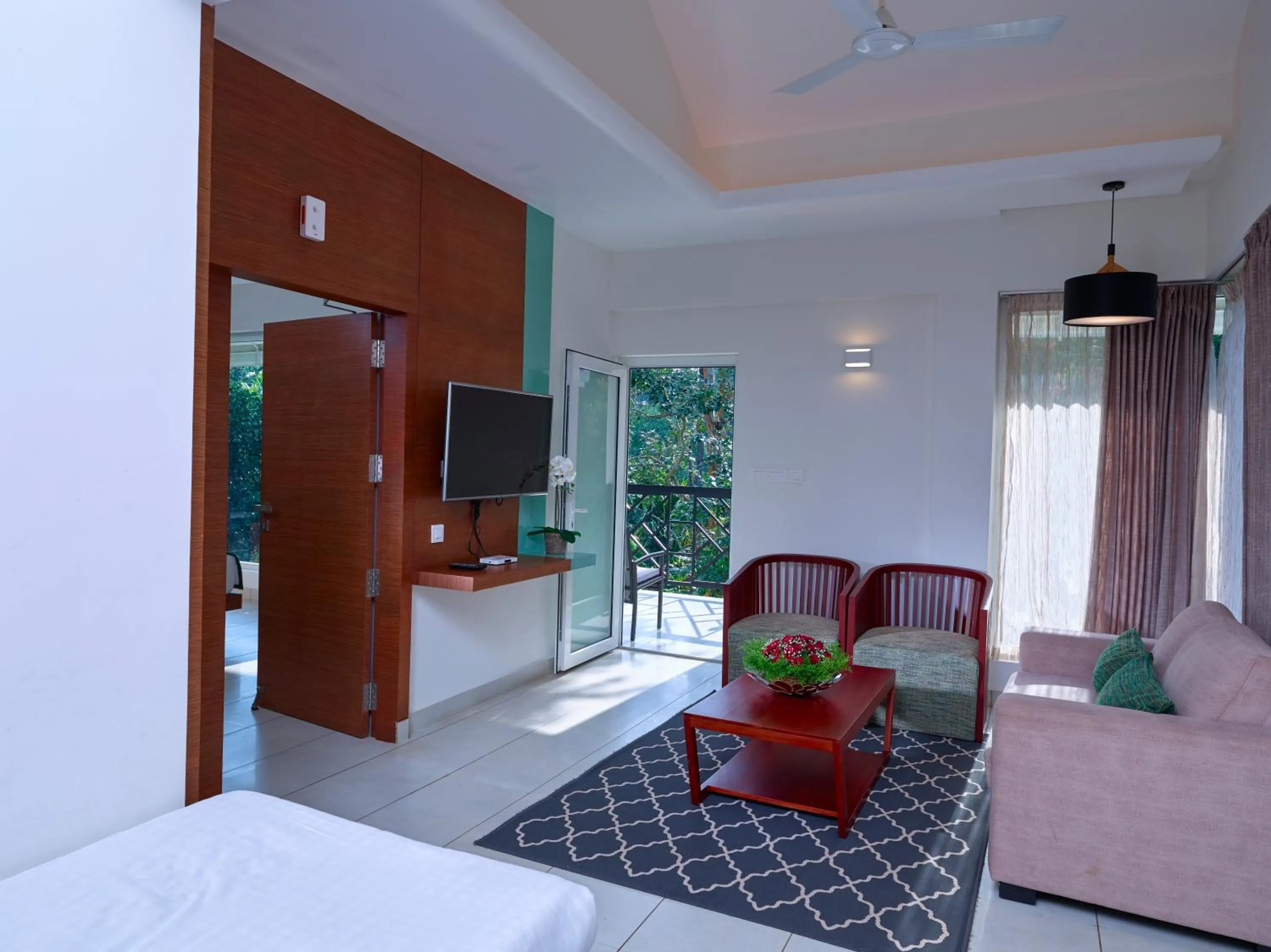Living room, Bed in The Woods Resorts Wayanad