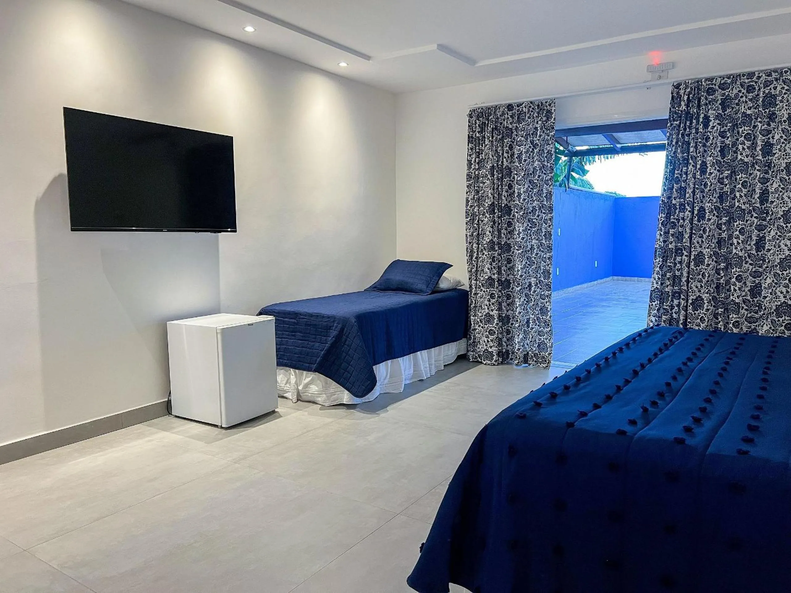 Communal lounge/ TV room, Bed in Pousada Brisa