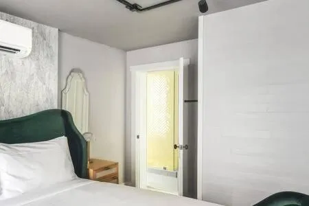 Bed in Yellow Room at Grand Maloney