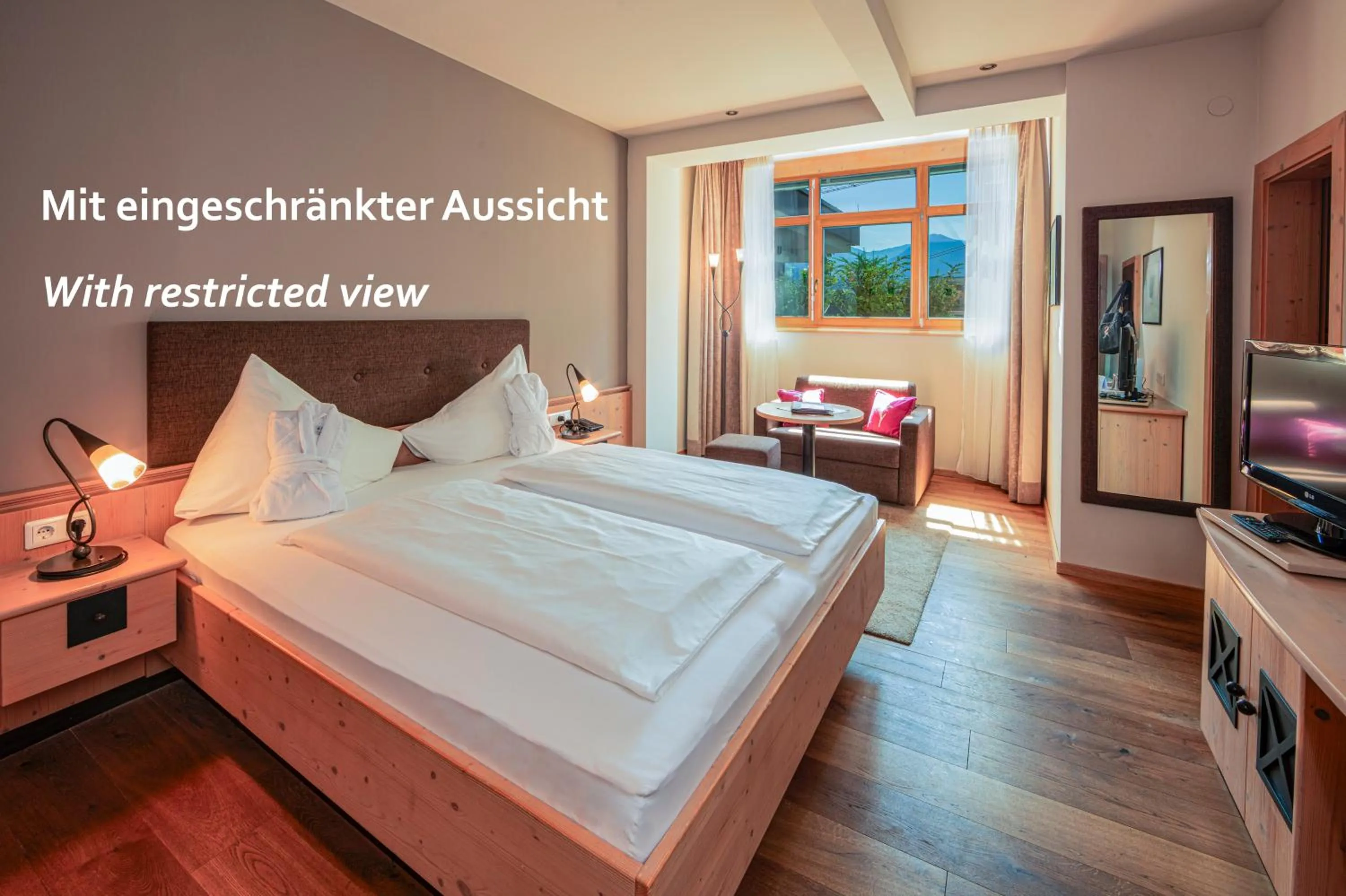 Photo of the whole room, Bed in Aktivhotel Schweizerhof Kitzbühel