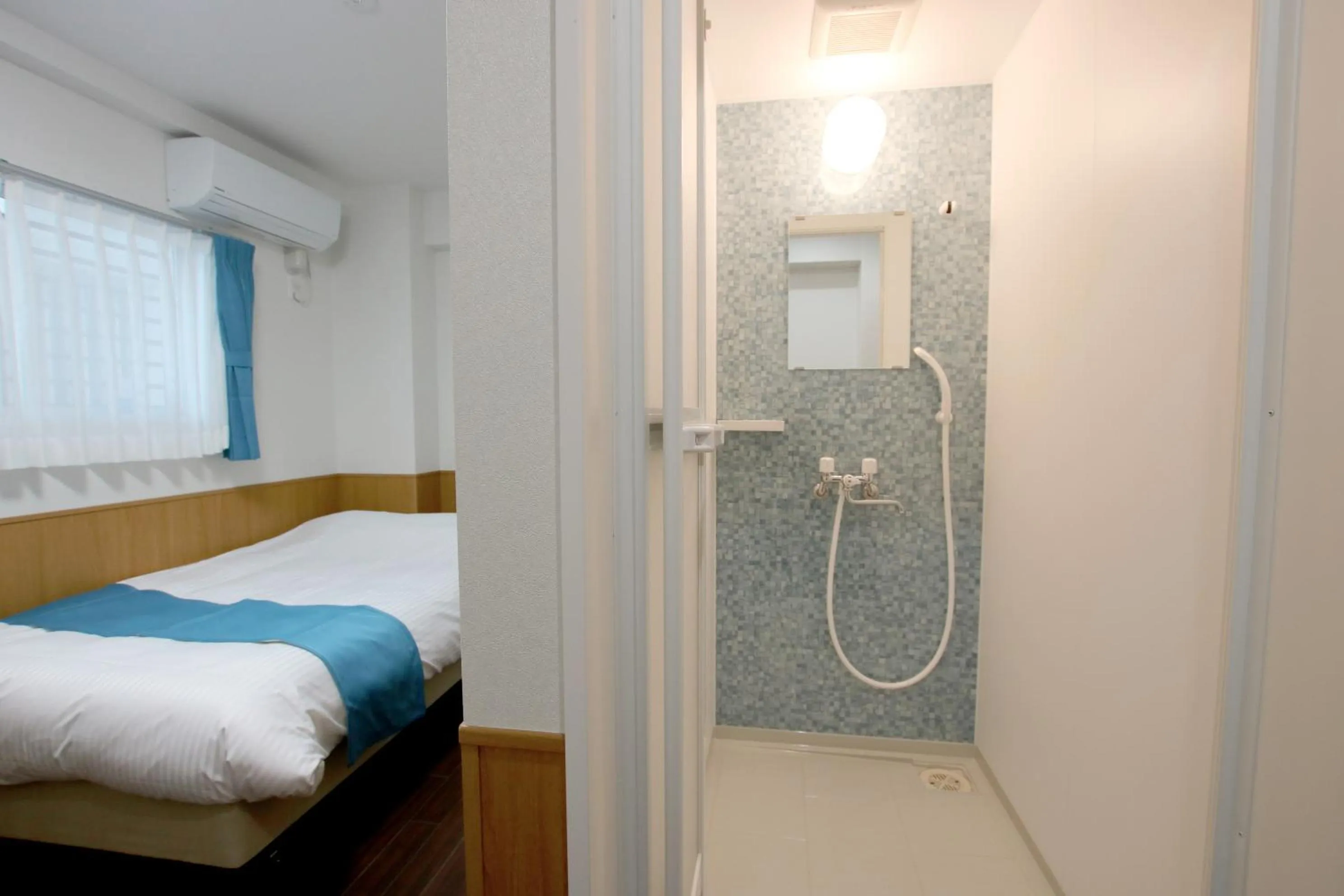 Bathroom, Bed in Phoenix Ryukyu Henzanbaru -SEVEN Hotels and Resorts-