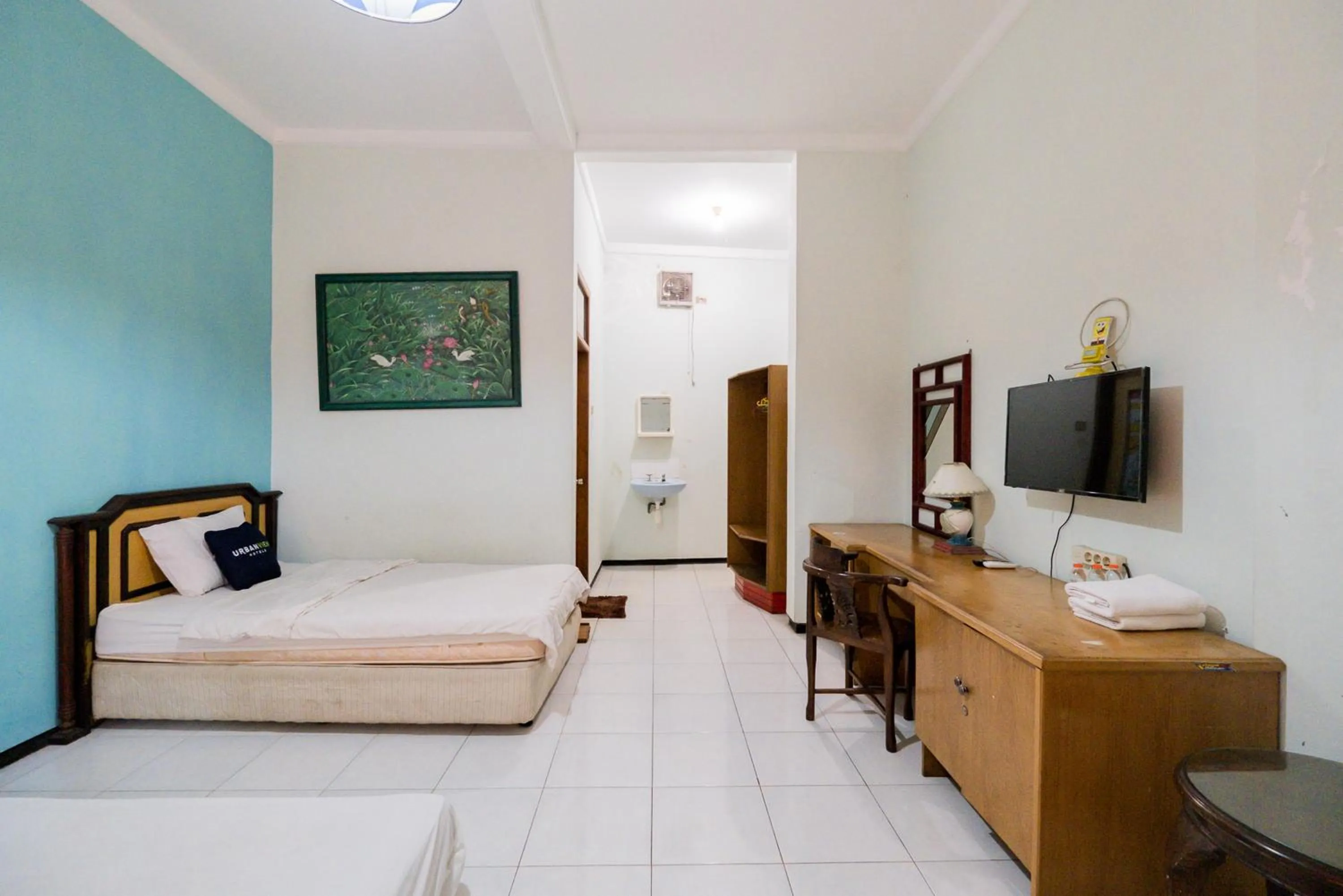 Bed in Urbanview Hotel Near Jatim Park 1 by RedDoorz