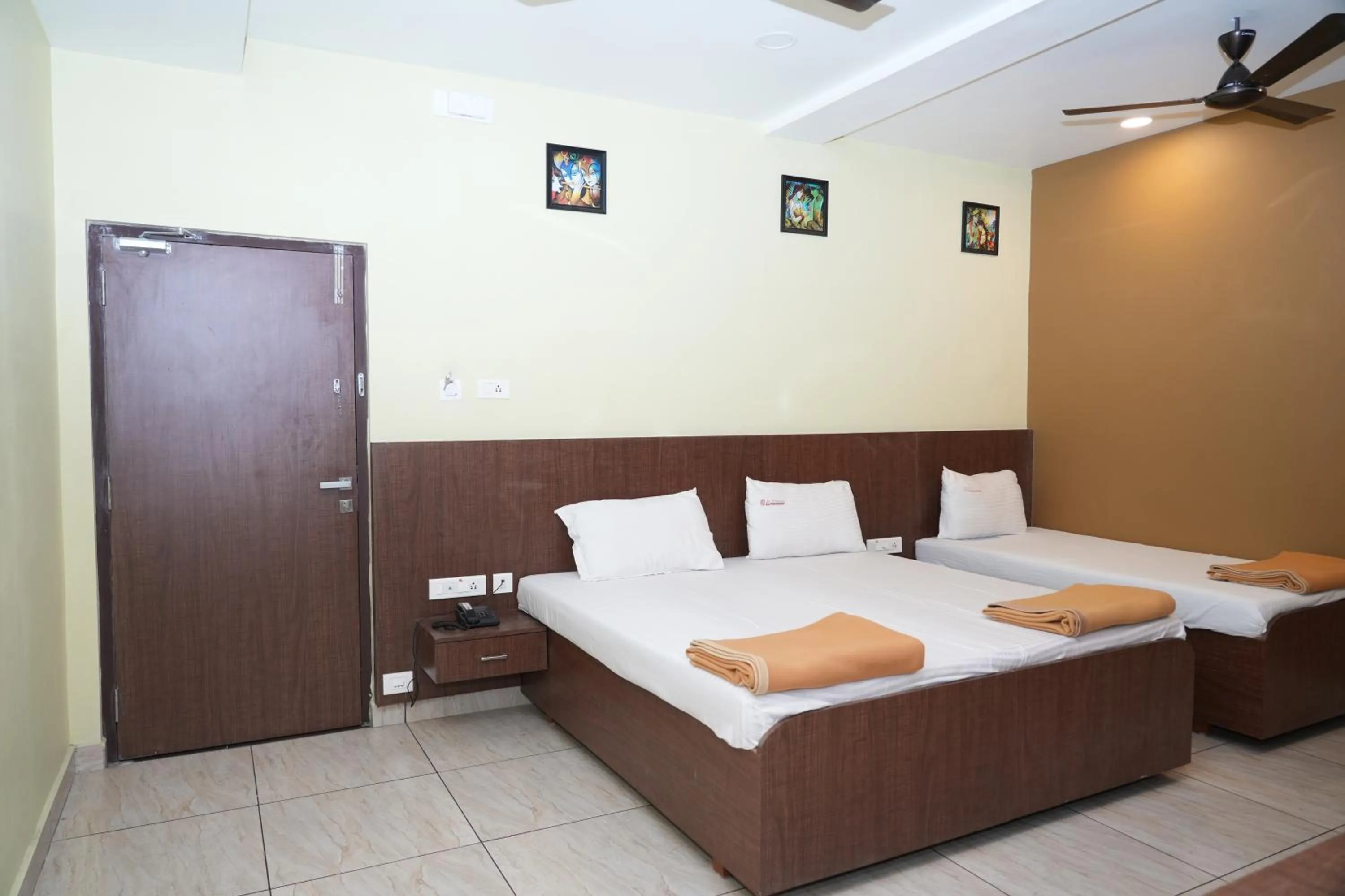 Photo of the whole room, Bed in Sri Krishnan Residency