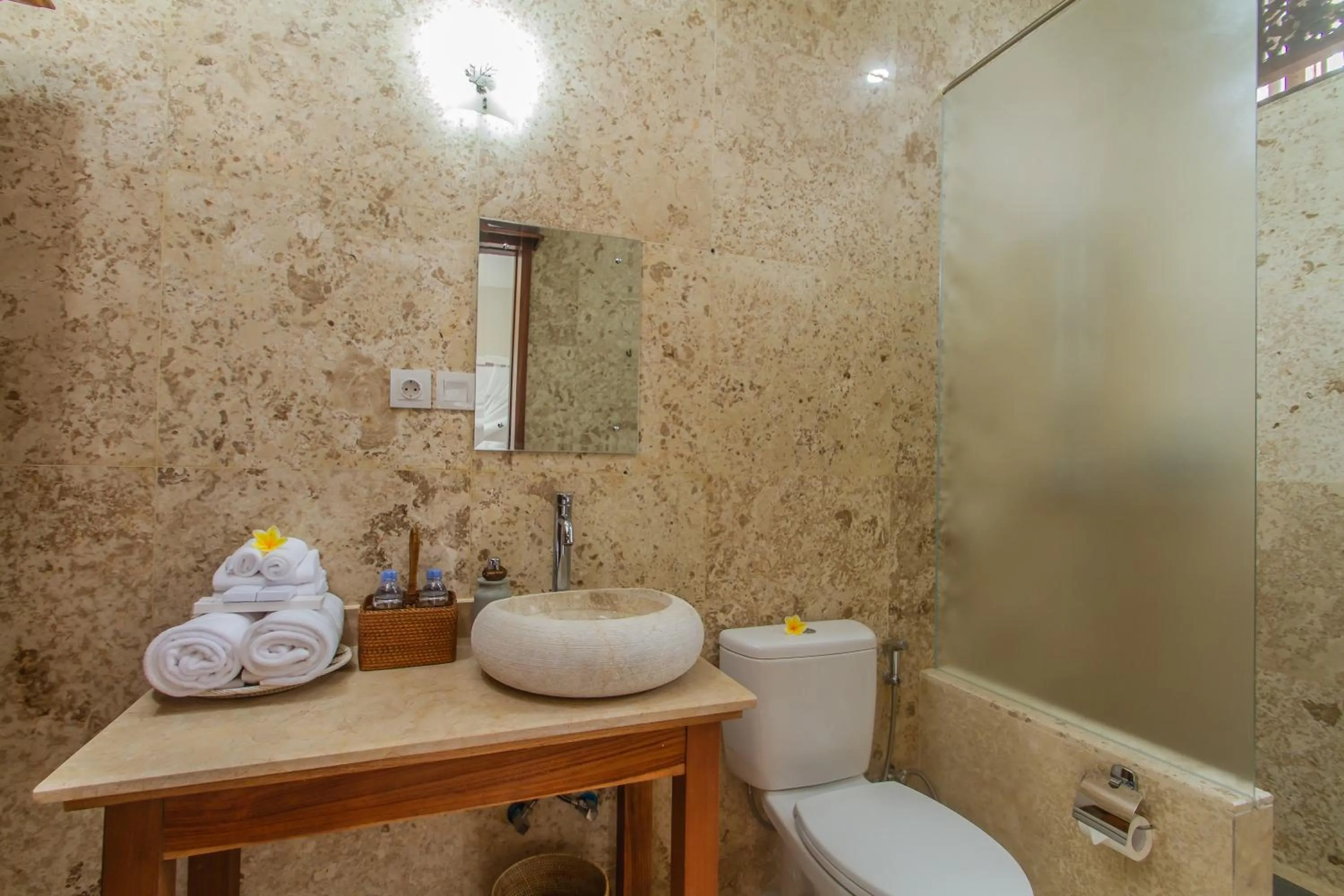 Bathroom in Graha Petulu Ubud by GenuineHost