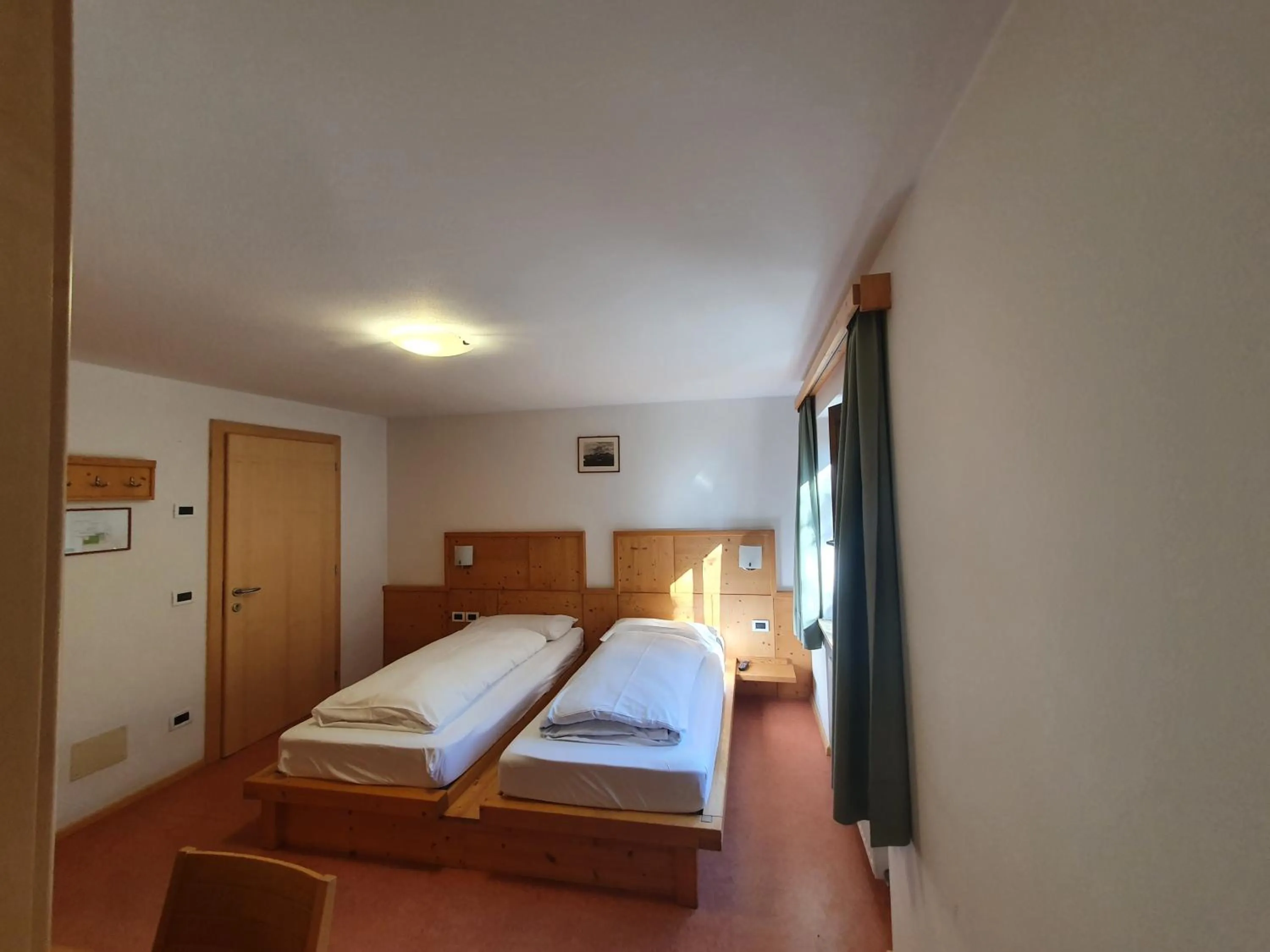 Bed in ALBERGO BAR RISTORANTE DOLOMIA