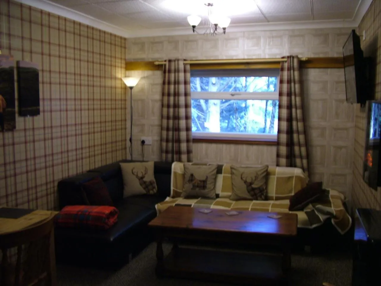 Seating area in The Steading Highland Glen Lodge