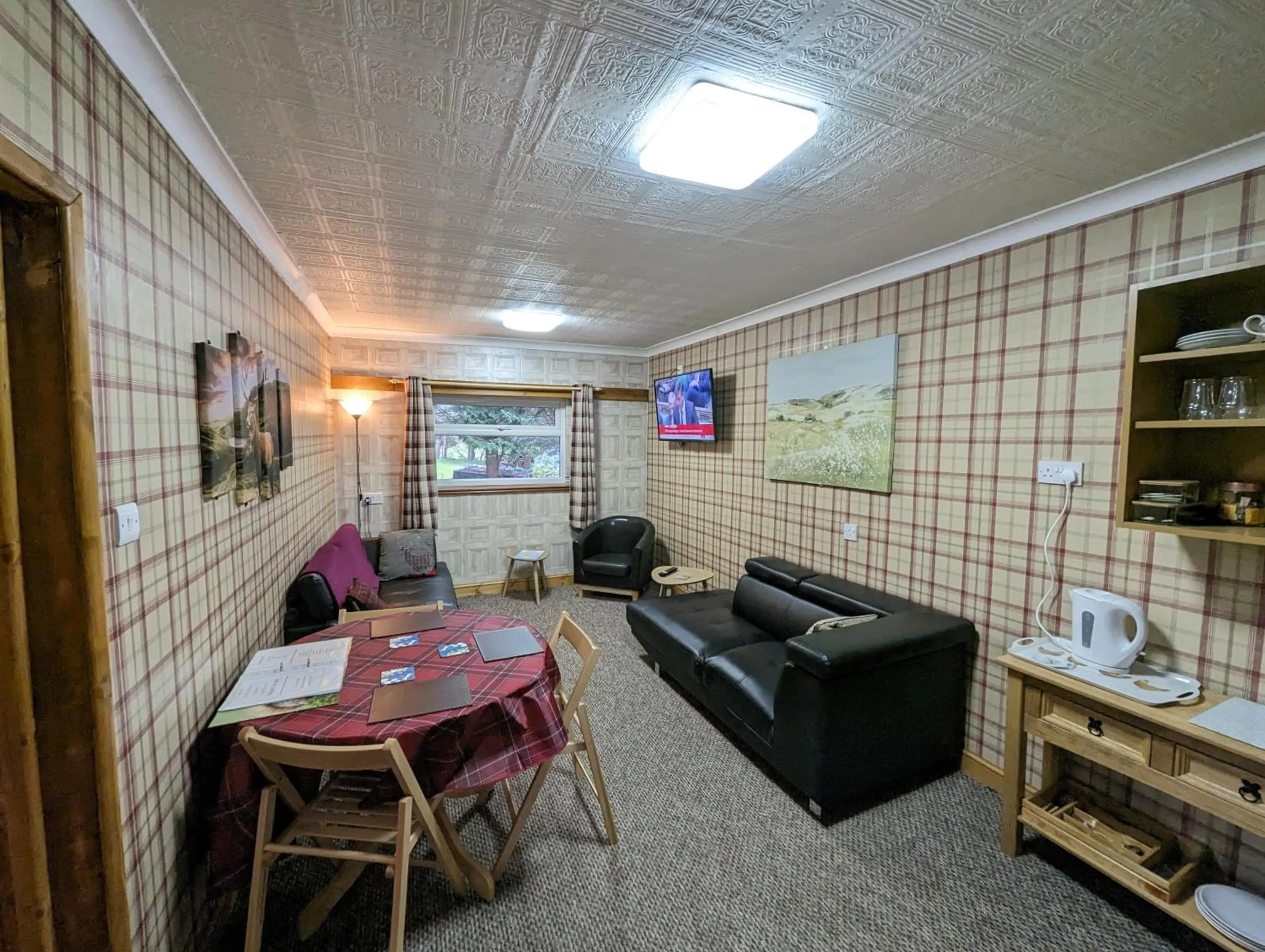 Seating area in The Steading Highland Glen Lodge