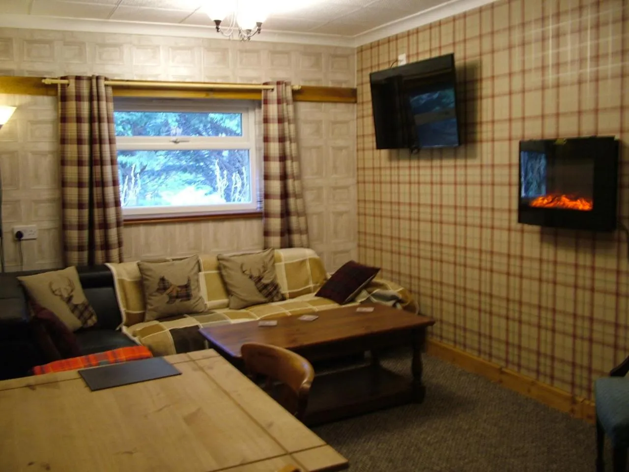 Seating area in The Steading Highland Glen Lodge