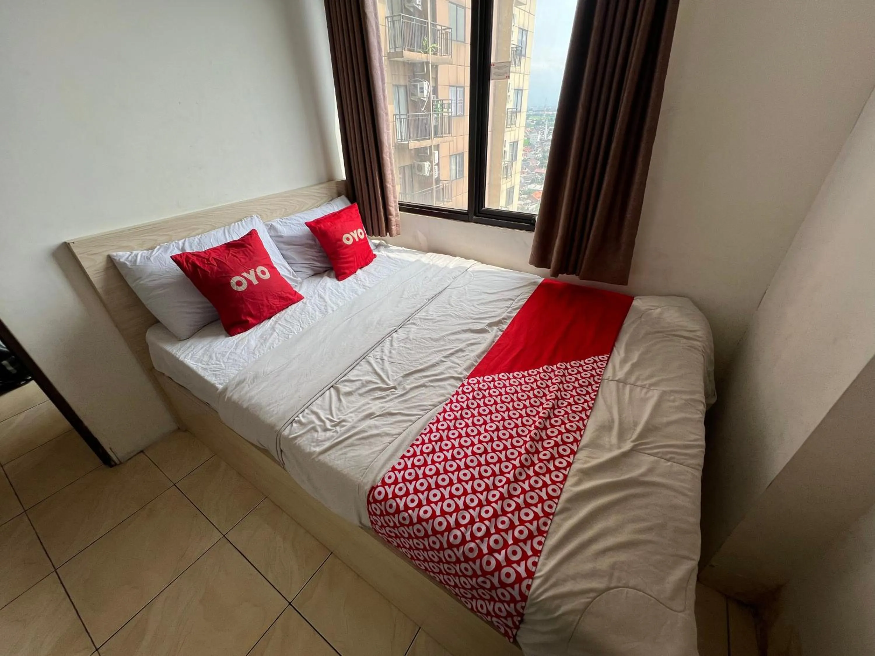 Bedroom in OYO 93828 Apartemen Tamansari Panoramic By Narel Room