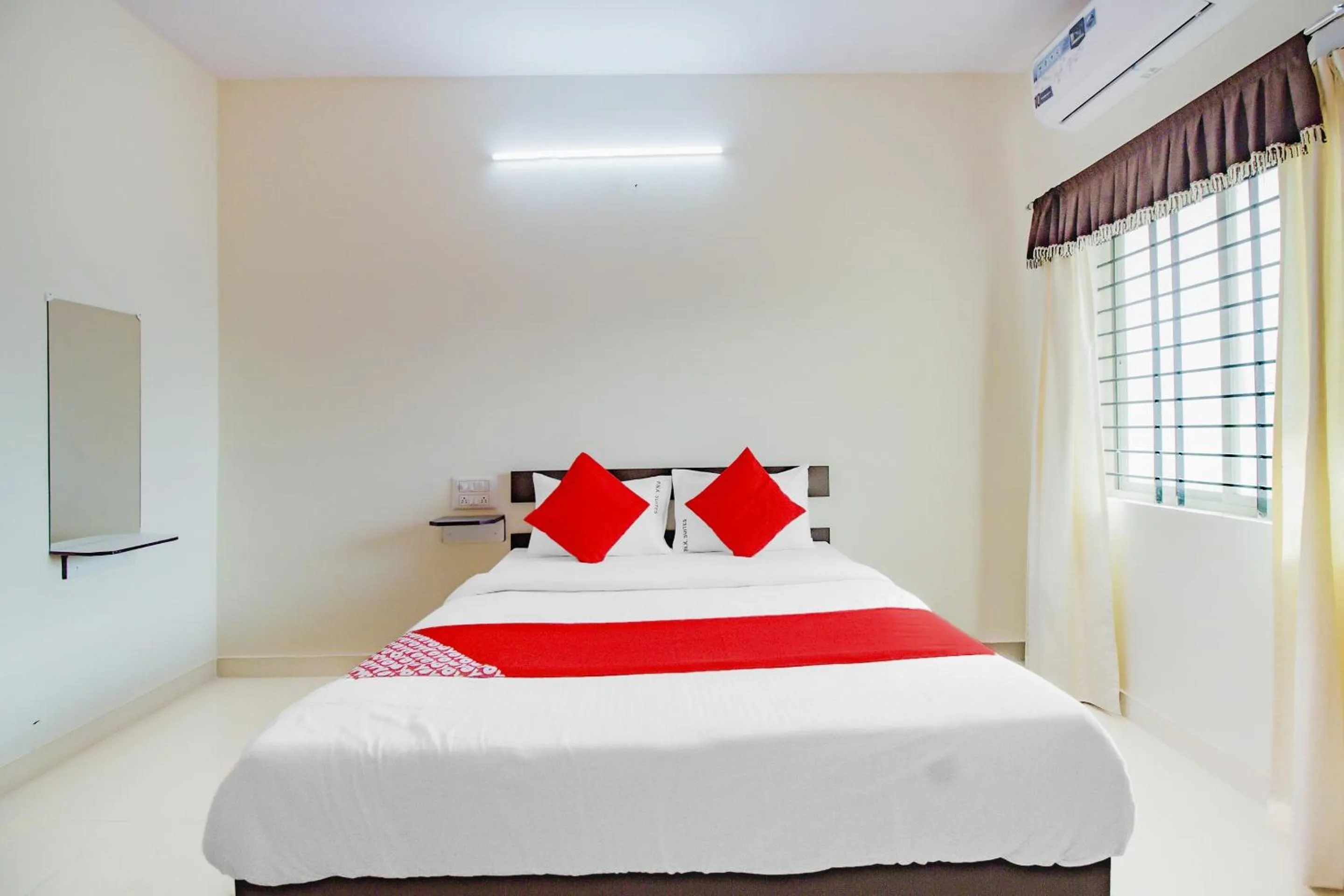 Bedroom in Hotel O P N K Suites