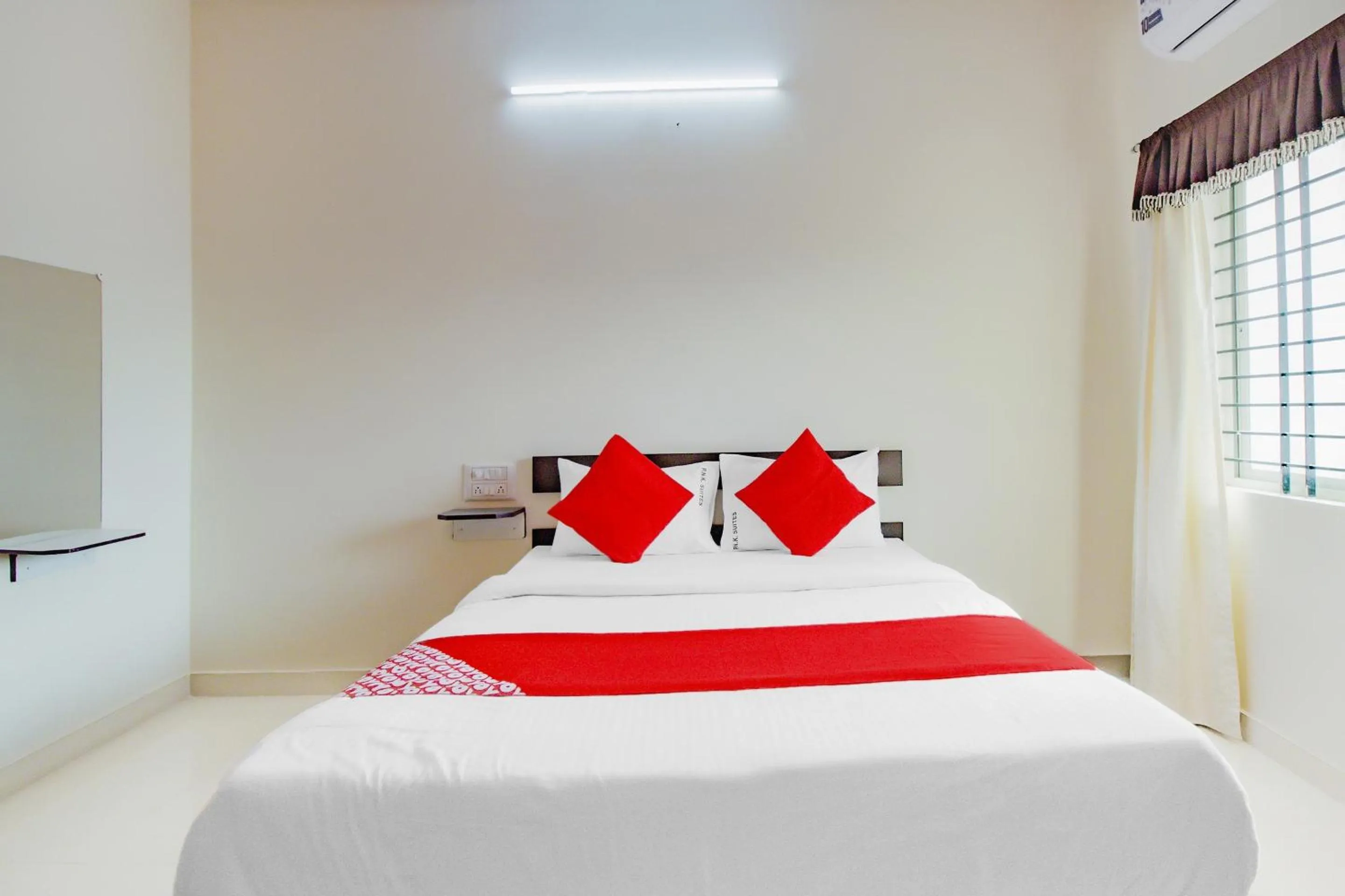 Bedroom in Hotel O P N K Suites