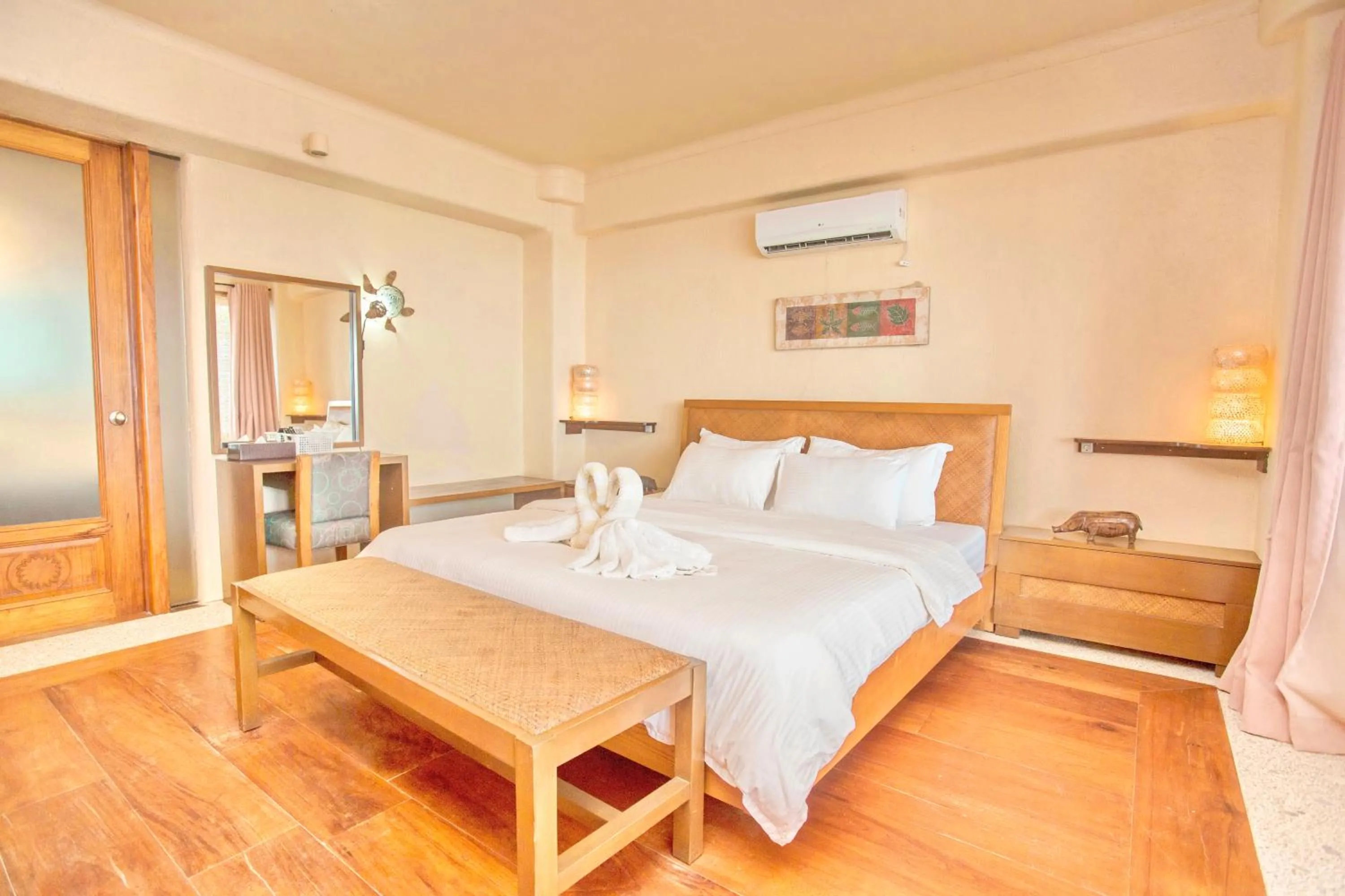 Bed in Mayumi Beach Villa