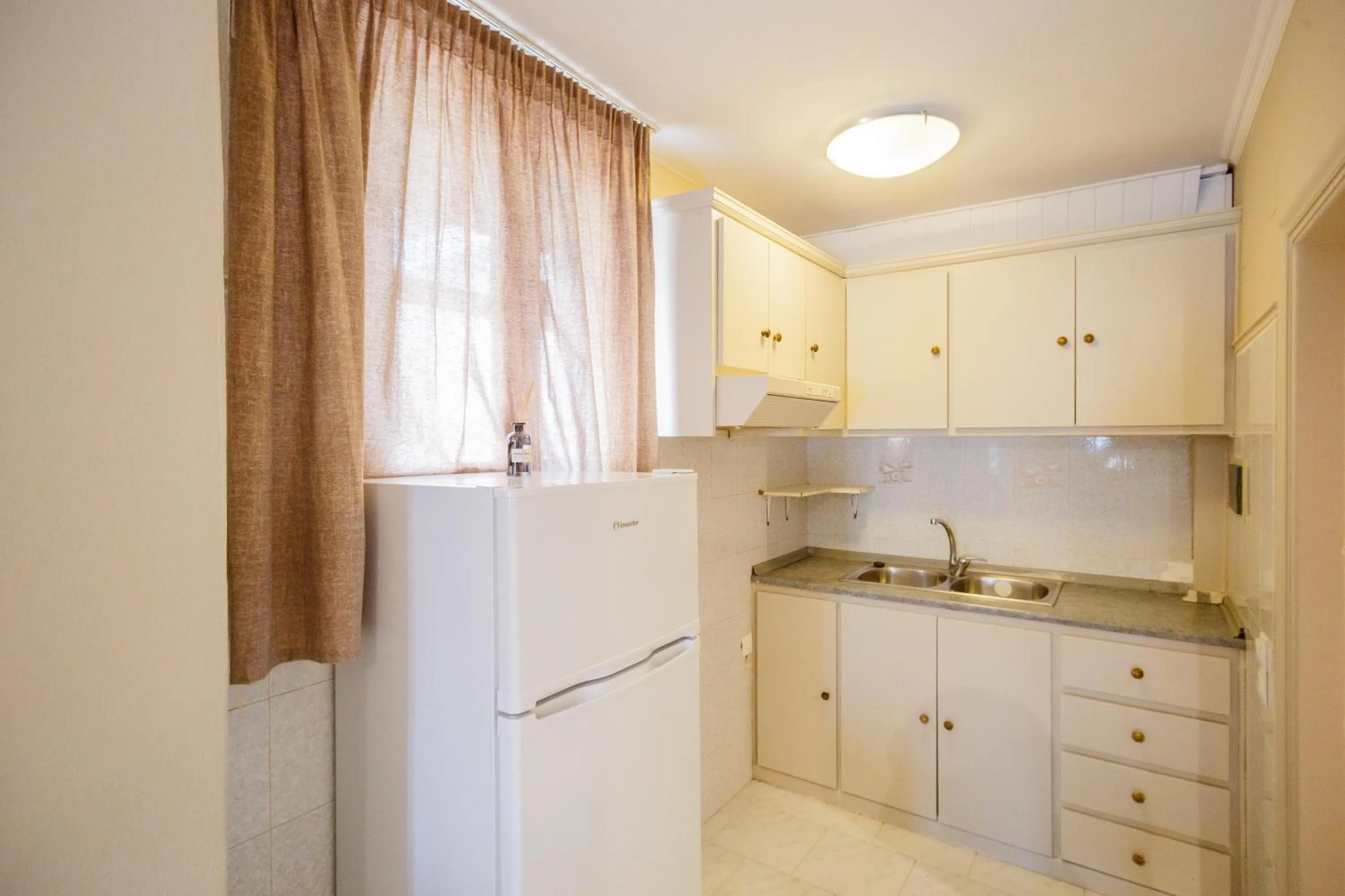 Kitchen or kitchenette in Rose Club Apartments