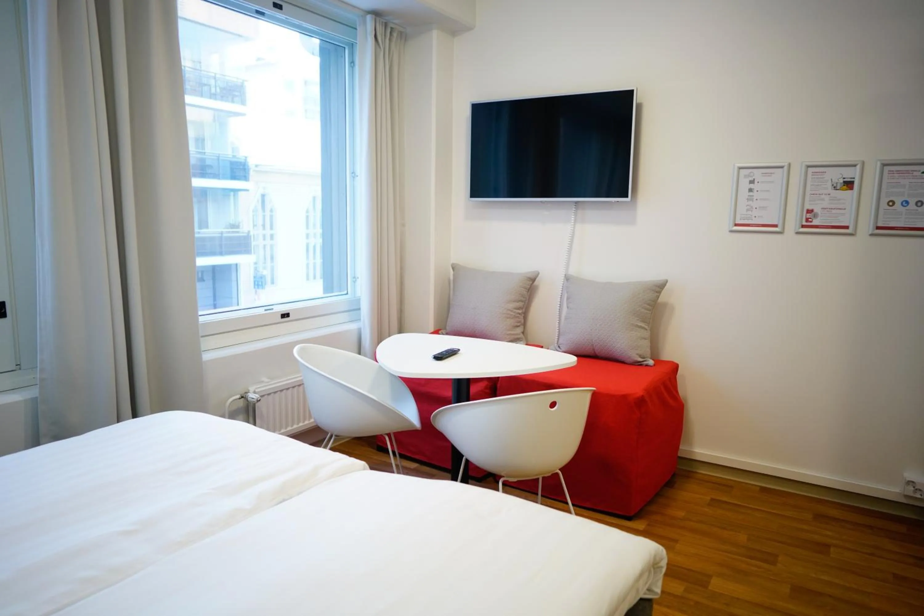 Seating area, Bed in Omena Hotel Pori