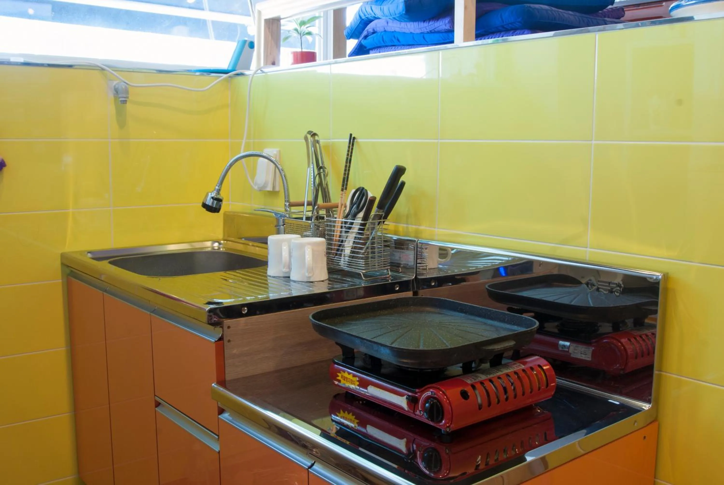 Kitchen or kitchenette in Nearest Guesthouse