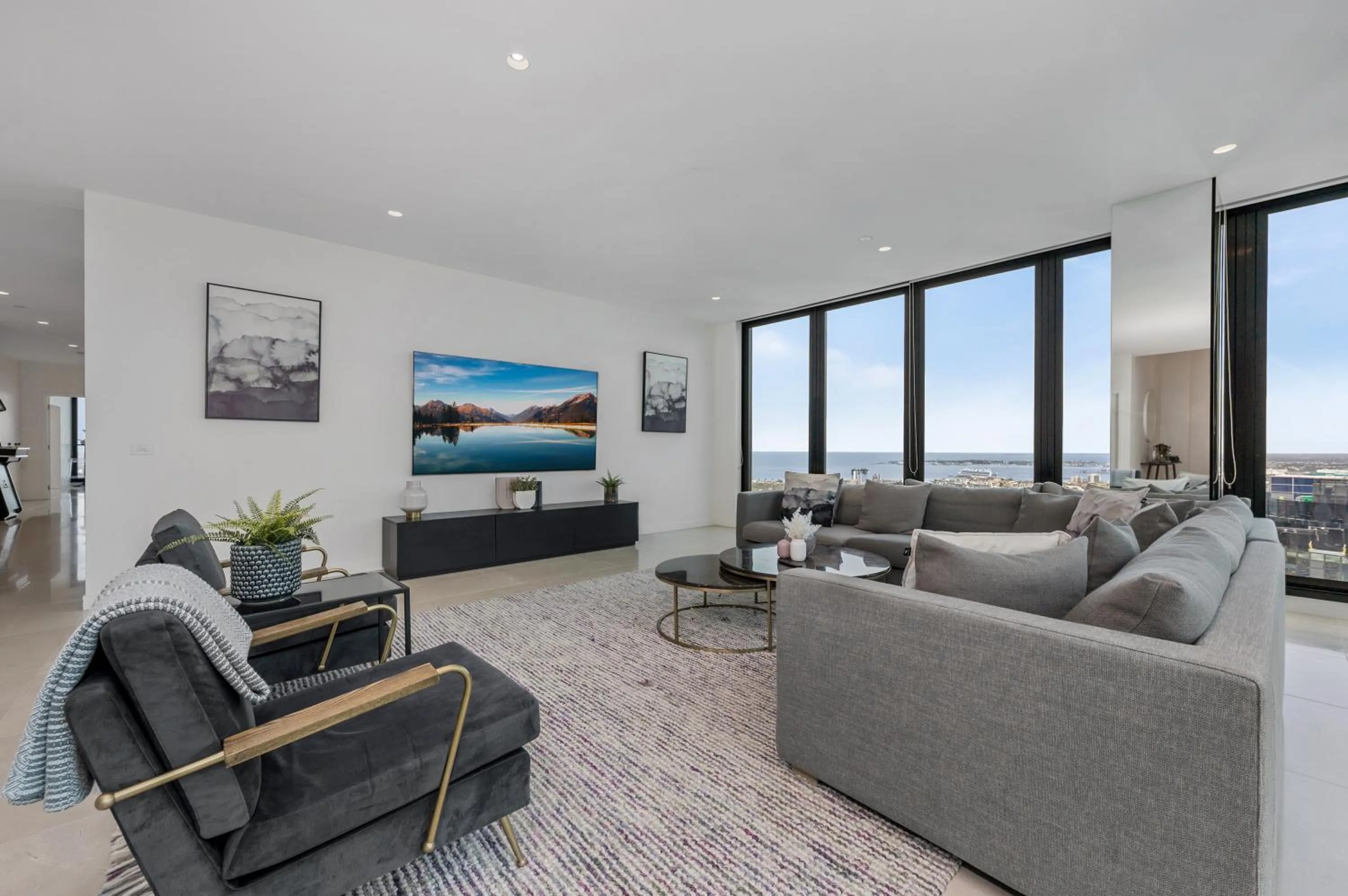 Living room in Melbourne City Apartments Panoramic Skyview Penthouse