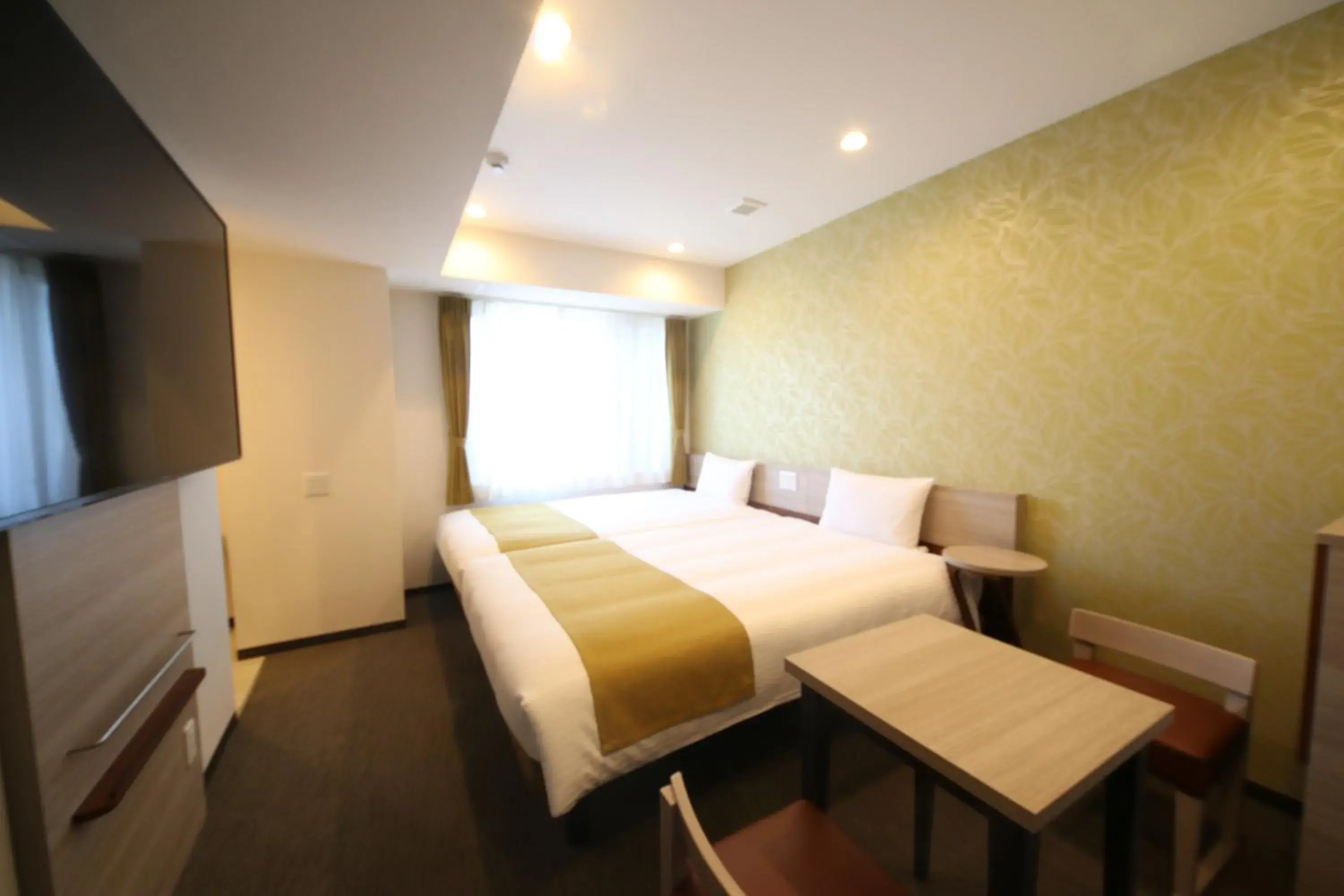 Bed in Kuretake Inn Premium Numazu Kitaguchi Ekimae Bed in Kuretake Inn Premium Numazu Kitaguchi Ekimae