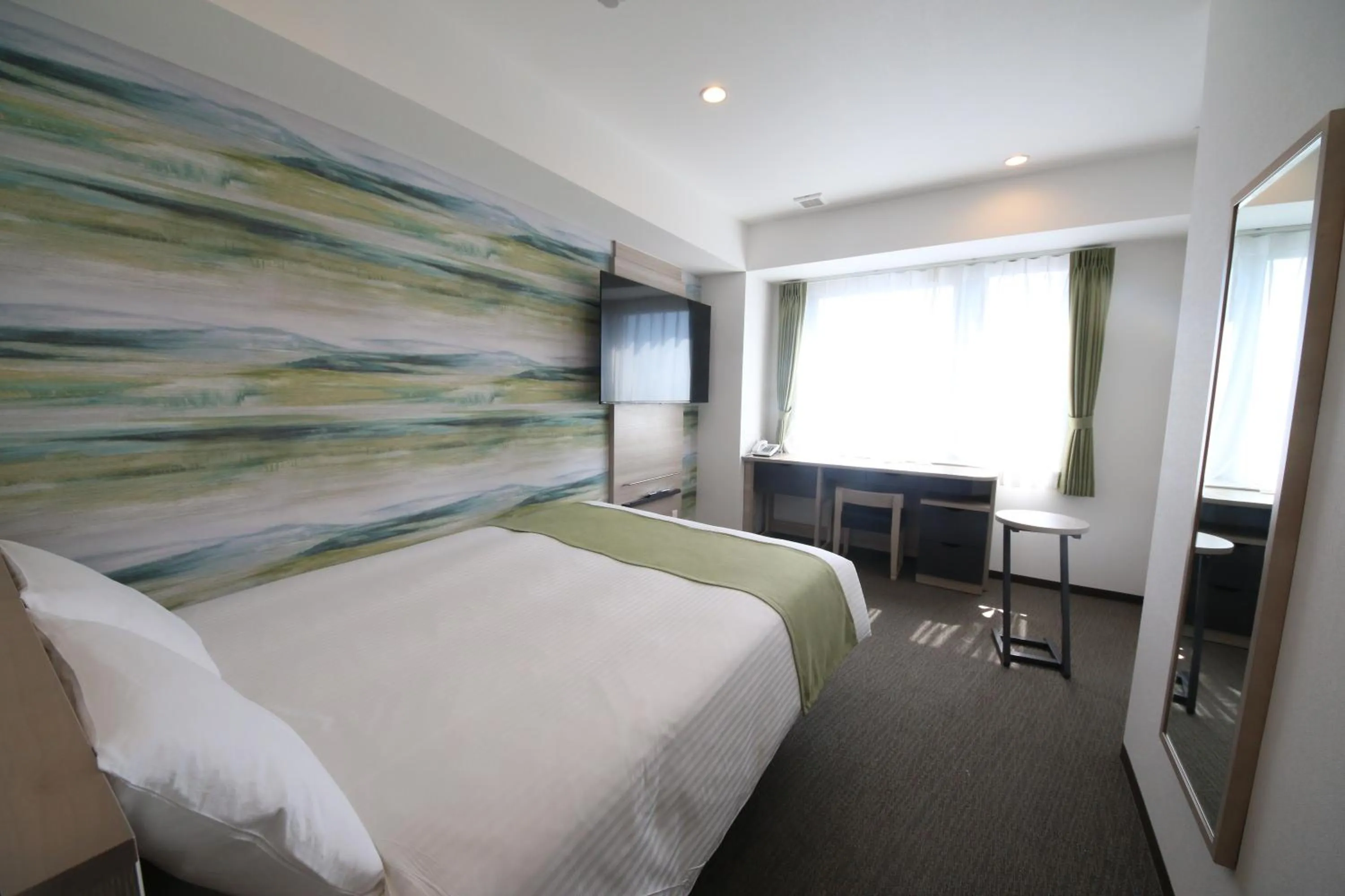 Bed in Kuretake Inn Premium Numazu Kitaguchi Ekimae