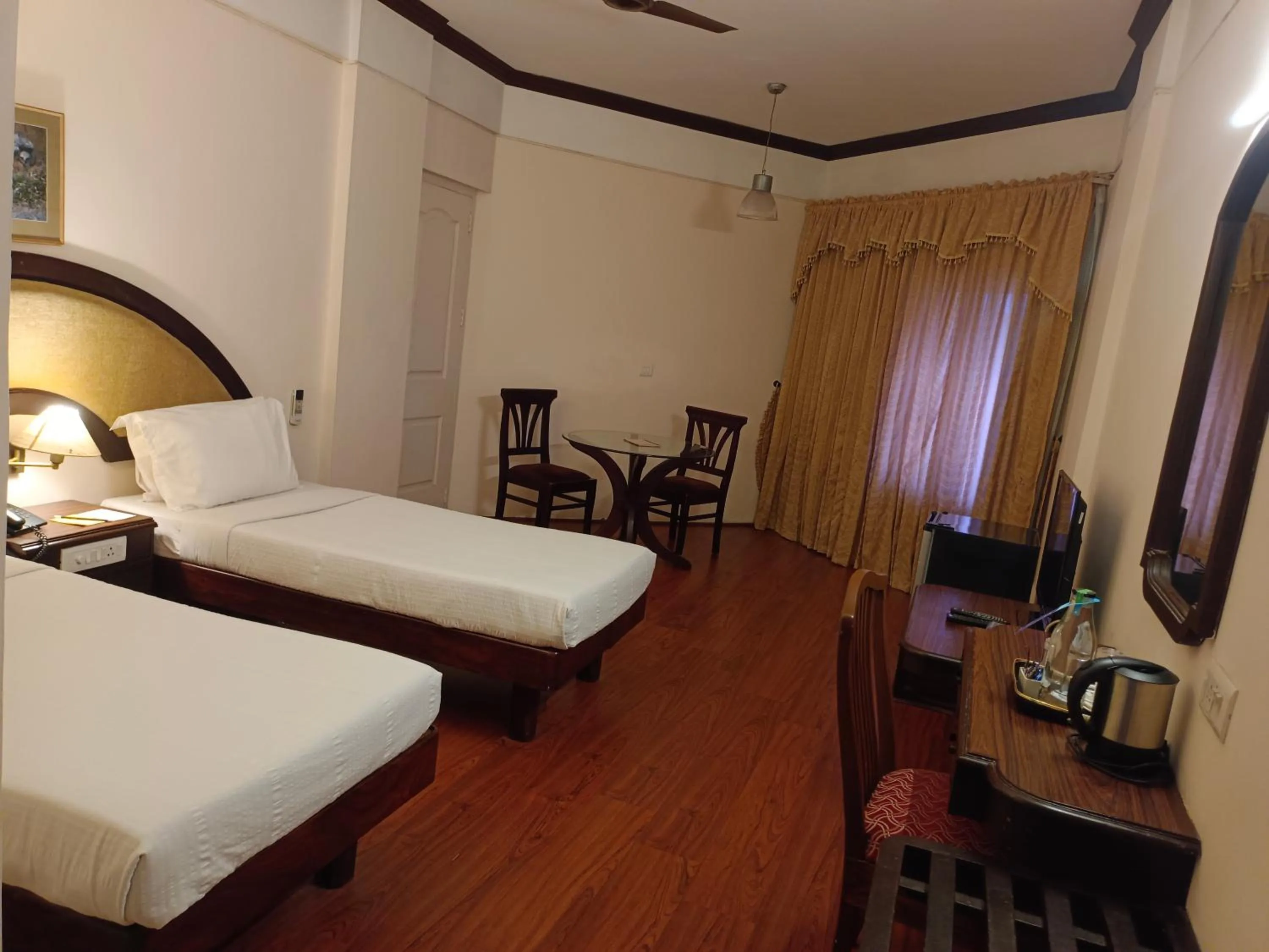 Bed in Manuelsons Malabar Palace