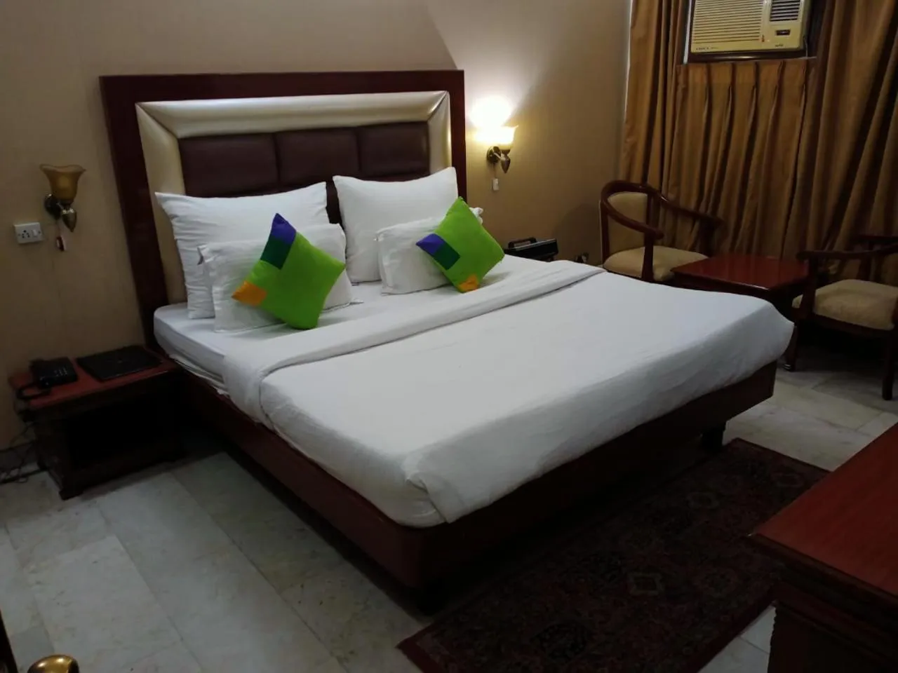 Bed in HOTEL CORPORATE INN