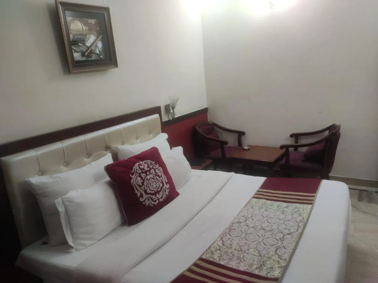 Bed in HOTEL CORPORATE INN