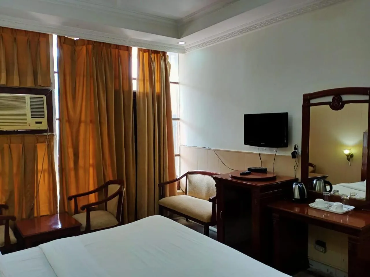 Bed in HOTEL CORPORATE INN