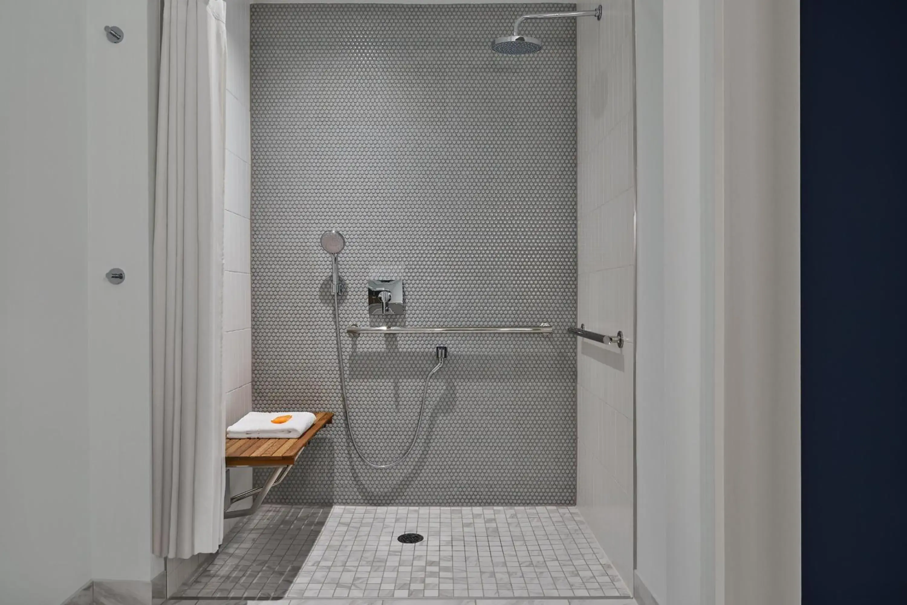 Traditional Queen Room with Two Queen Beds and Adapted Tub - Mobility and Hearing Accessible (Includes Early Entry To Disney Theme Parks) in Walt Disney World Swan Reserve Traditional Queen Room with Two Queen Beds and Adapted Tub - Mobility and Hearing Accessible (Includes Early Entry To Disney Theme Parks) in Walt Disney World Swan Reserve