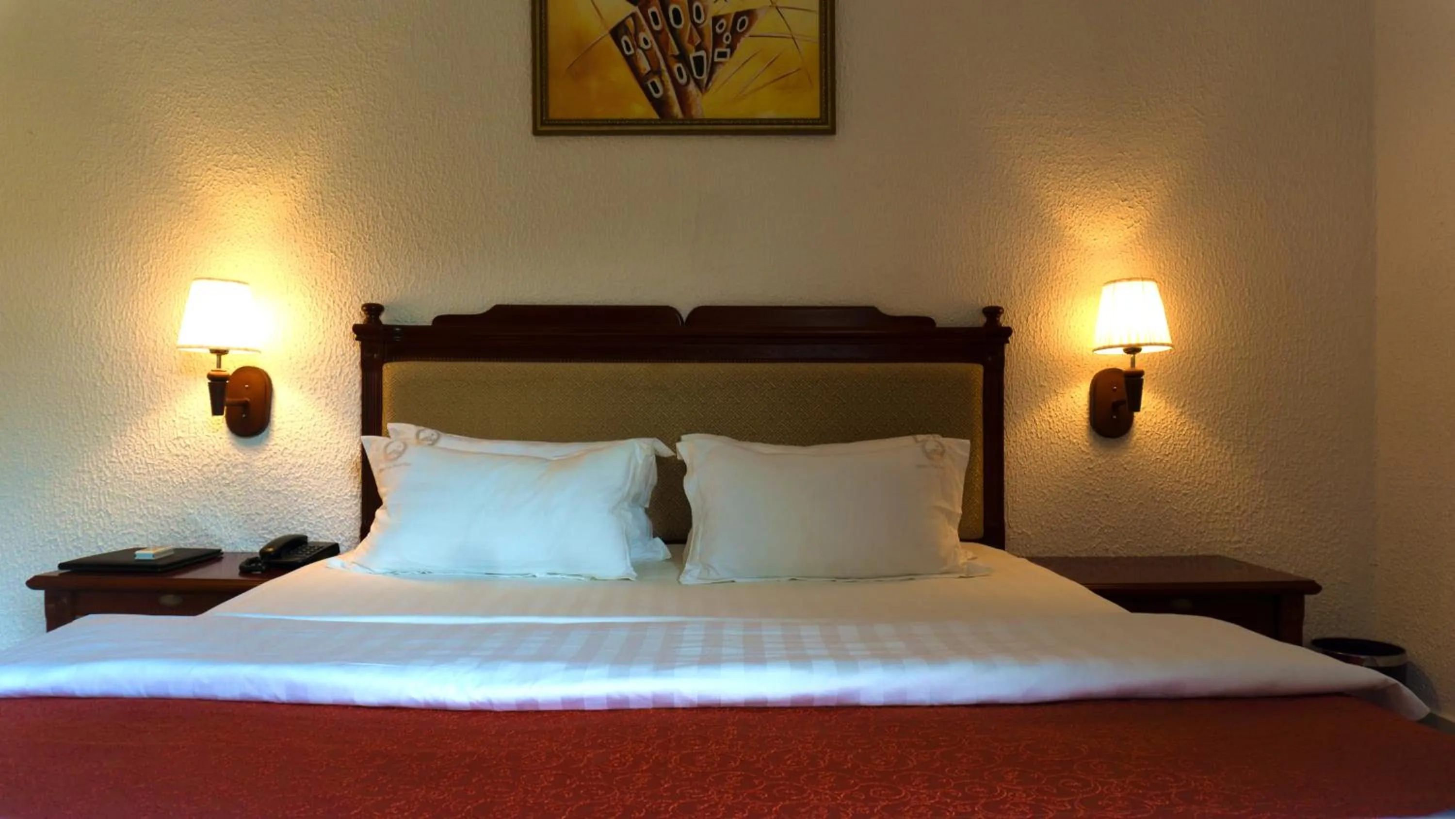 Bed in Millenium Popo Beach Hotel