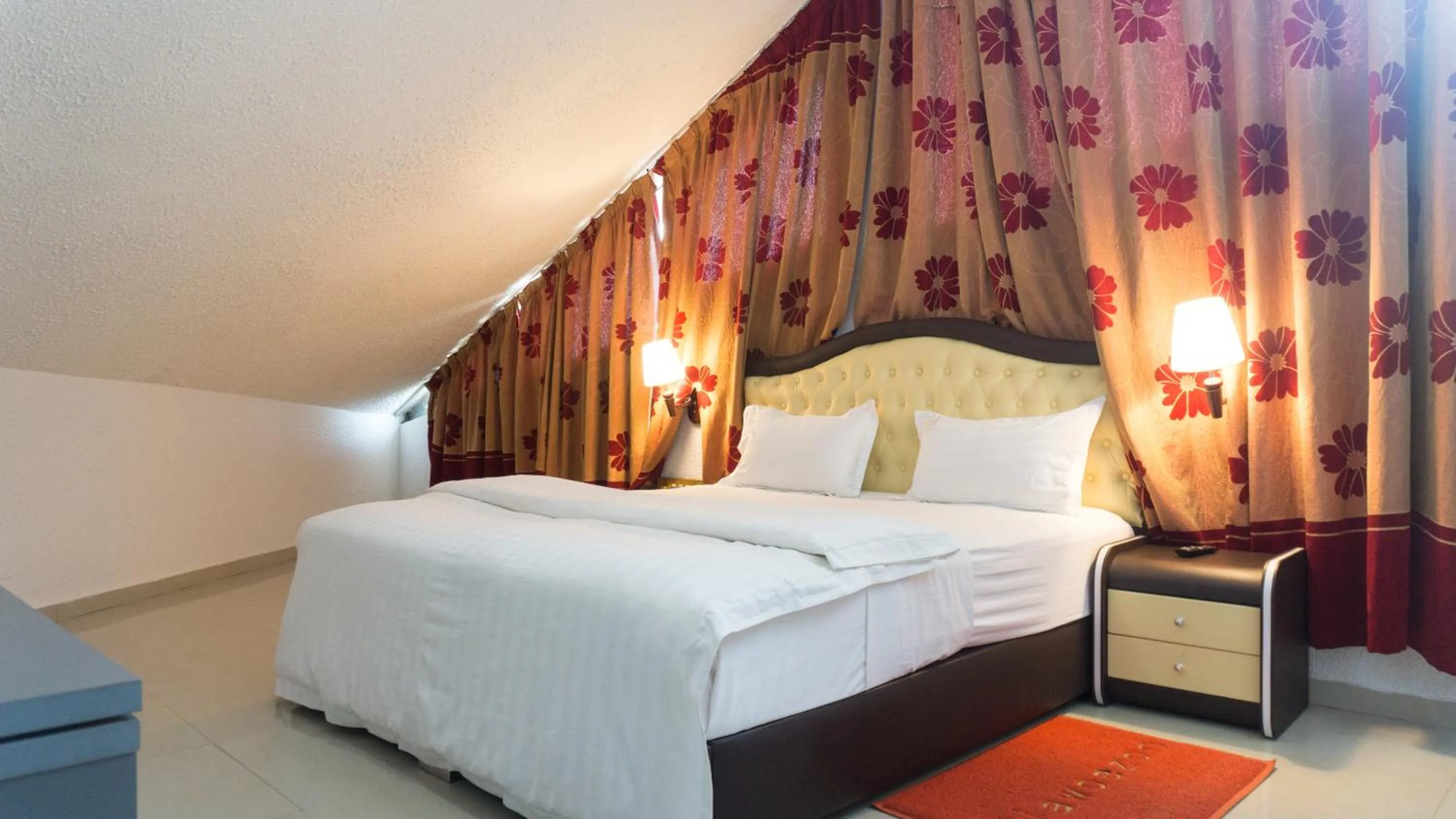 Bed in Millenium Popo Beach Hotel