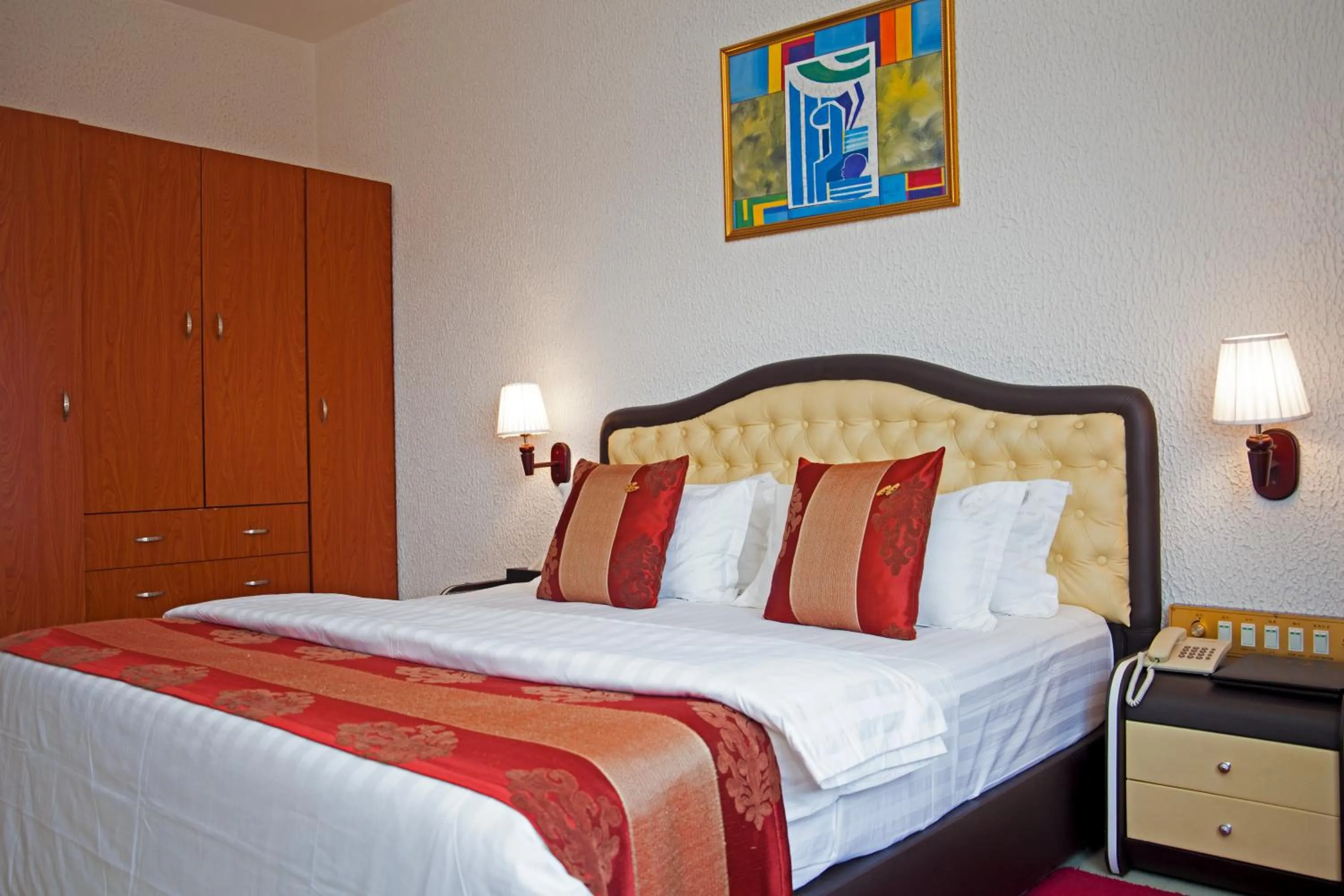 Bed in Millenium Popo Beach Hotel