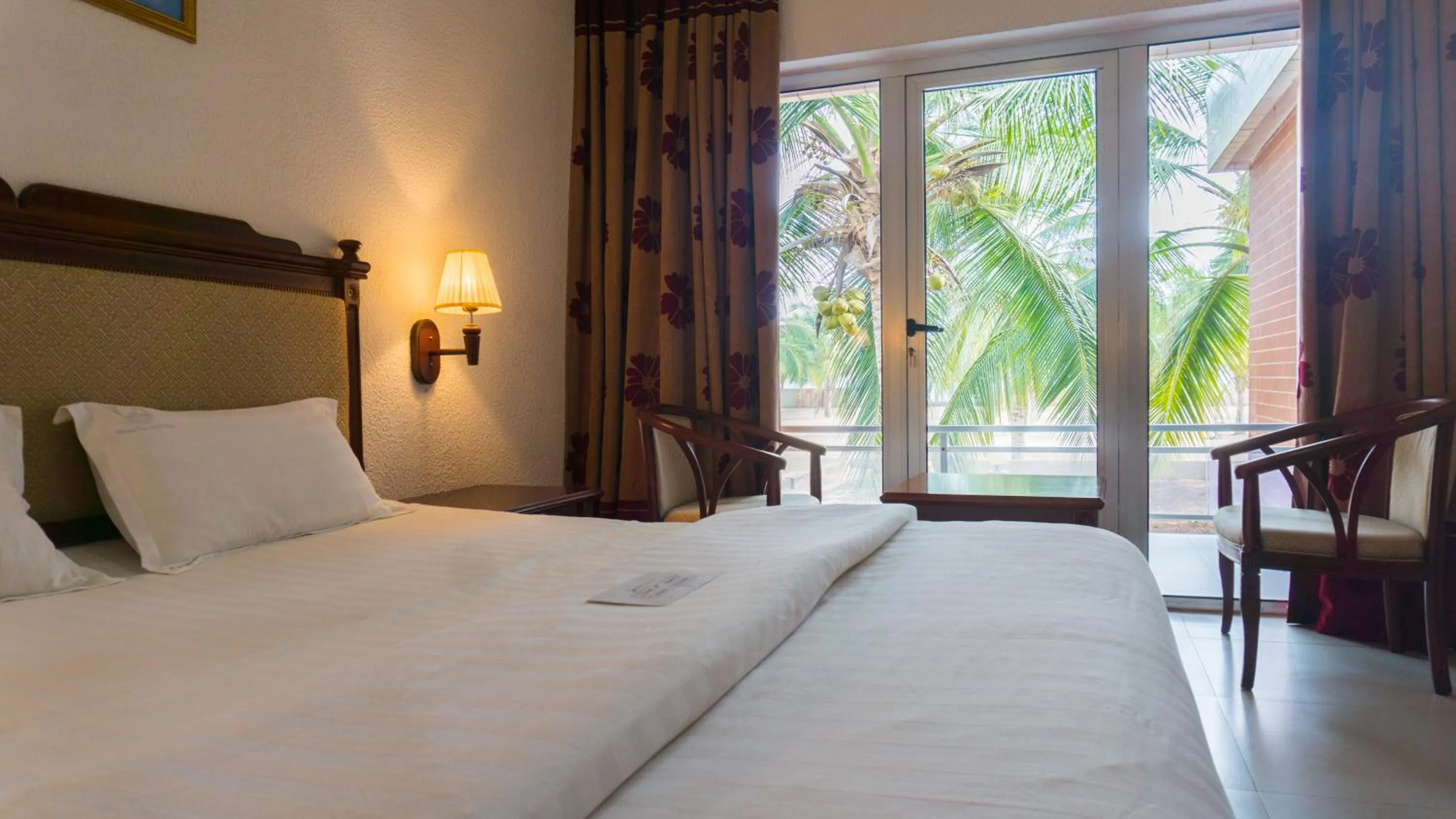 Bed in Millenium Popo Beach Hotel