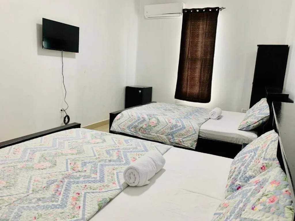 Bed in Hotel Coastalbay 2 & Golf Cart Rental